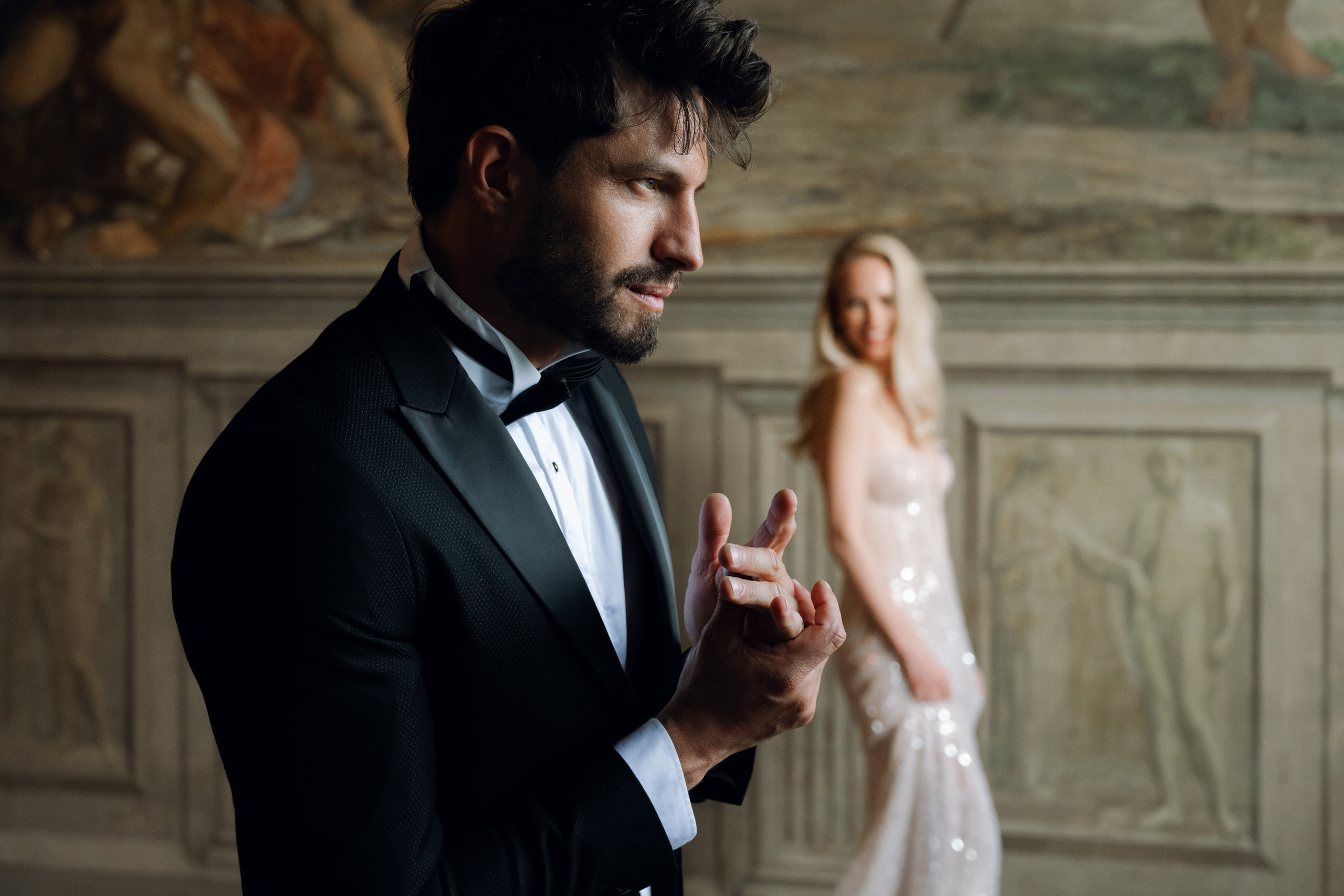 a man in a tuxed suit and bow tie