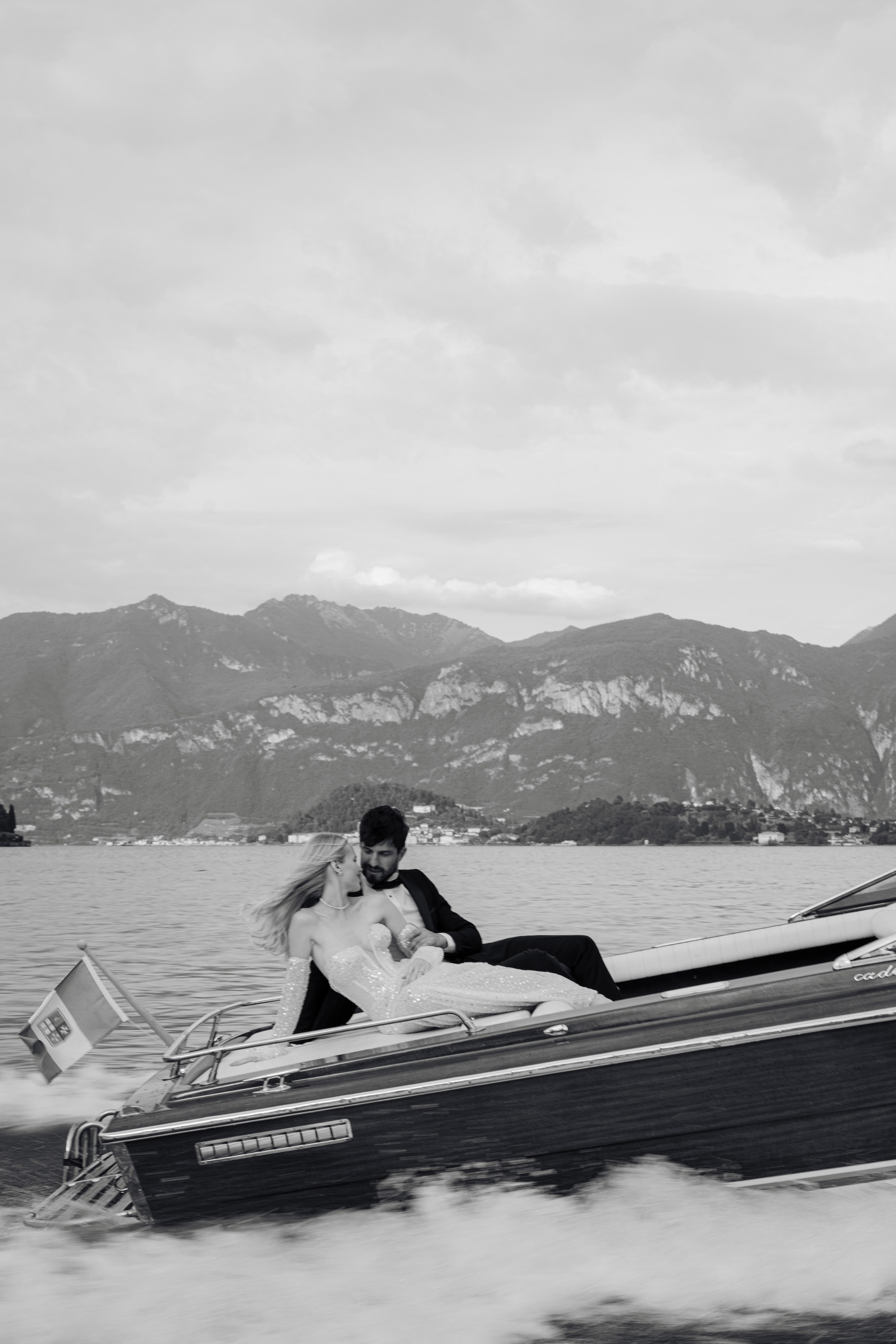 a man and woman in a boat on the water