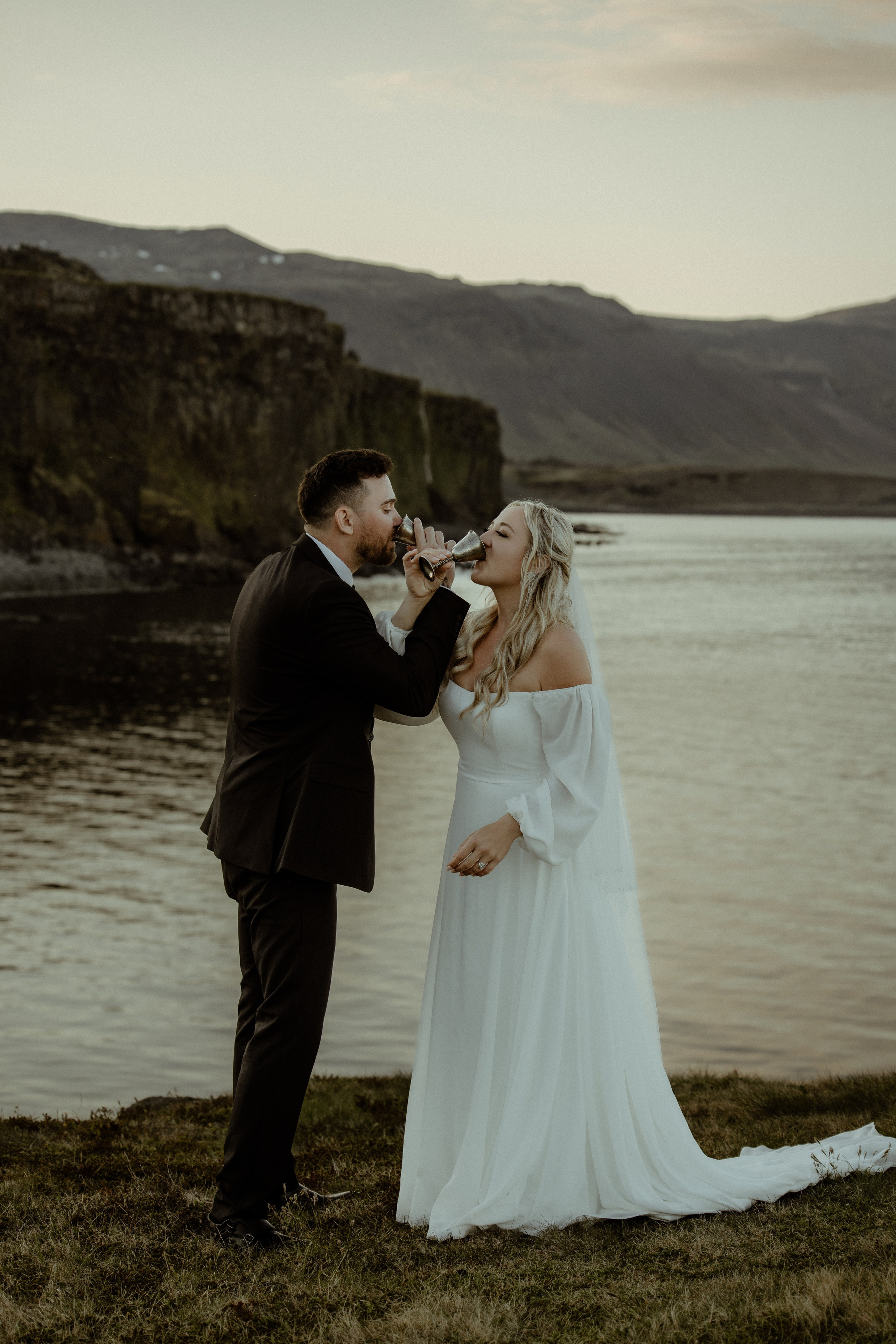 Iceland elopement at Budir with midnight sun wedding photos at black sand beach. Iceland elopement photographer & videographer