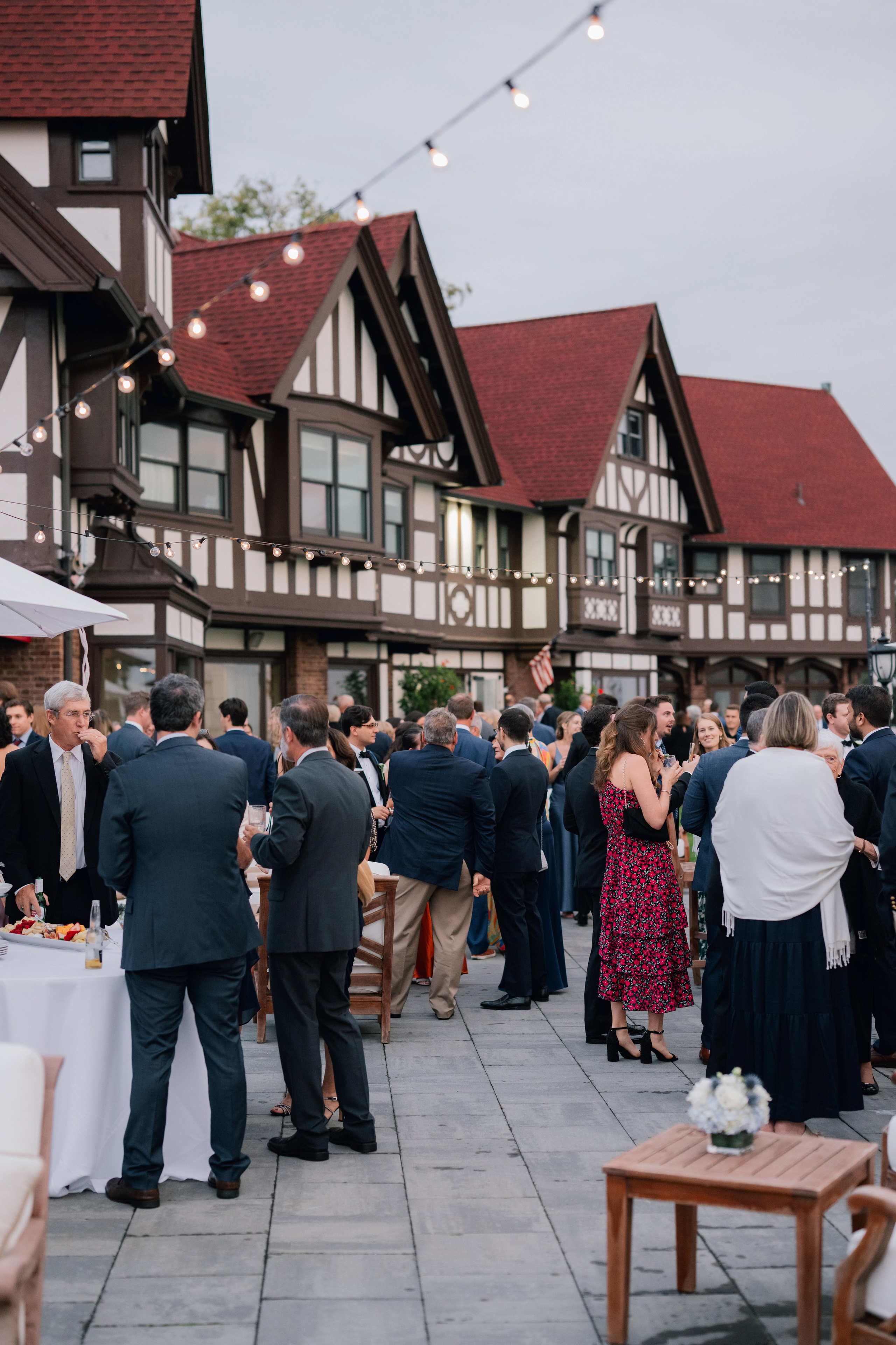 a group of people standing around a table