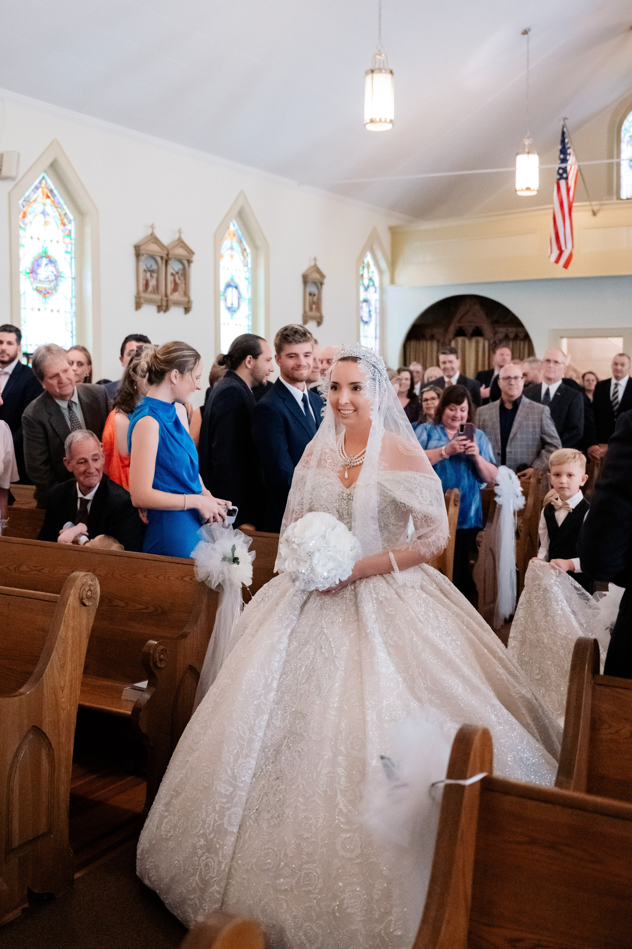 a bride walking down the aisle of a church