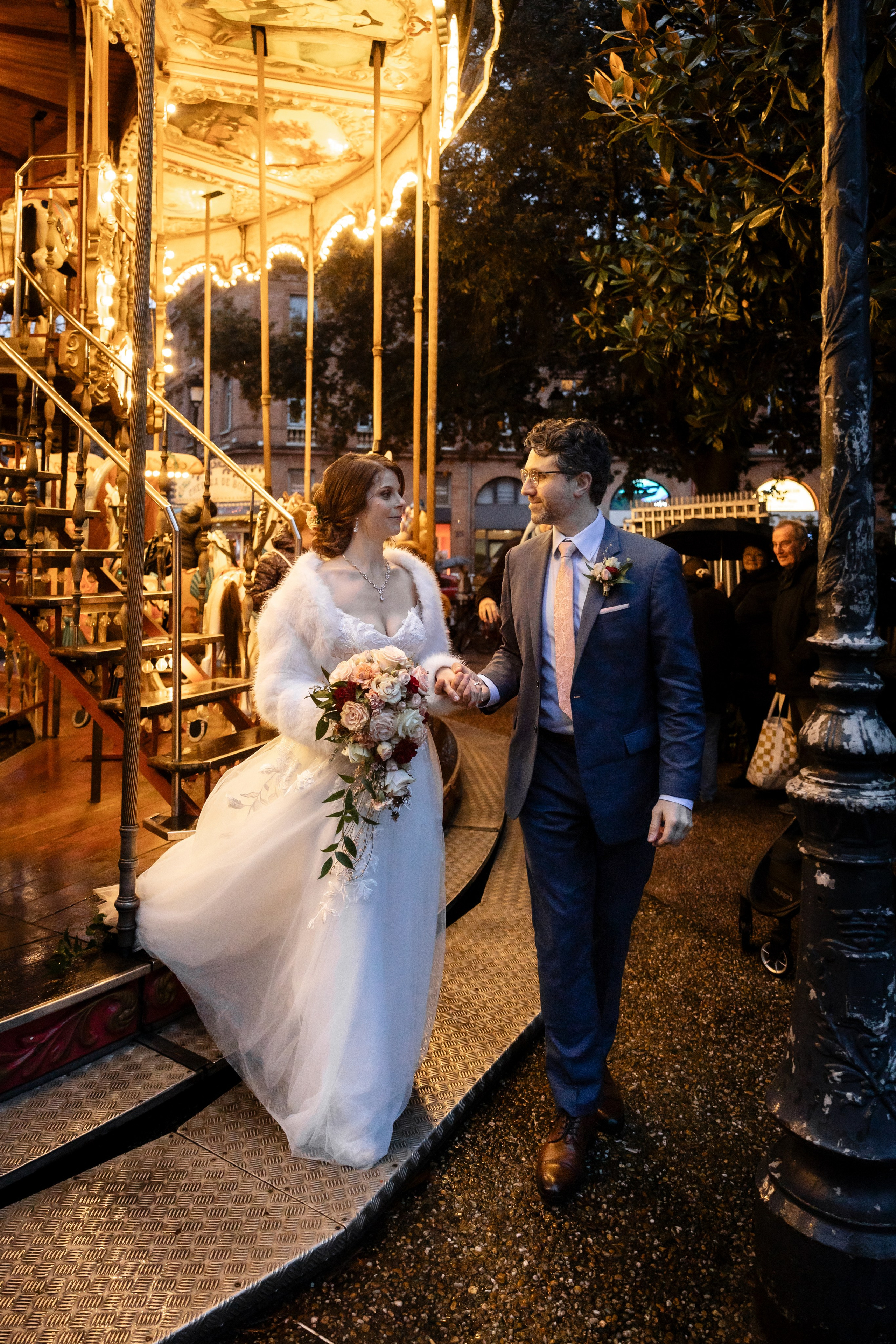 Couple of newlyweds on the carousel of Place Wilson Toulouse