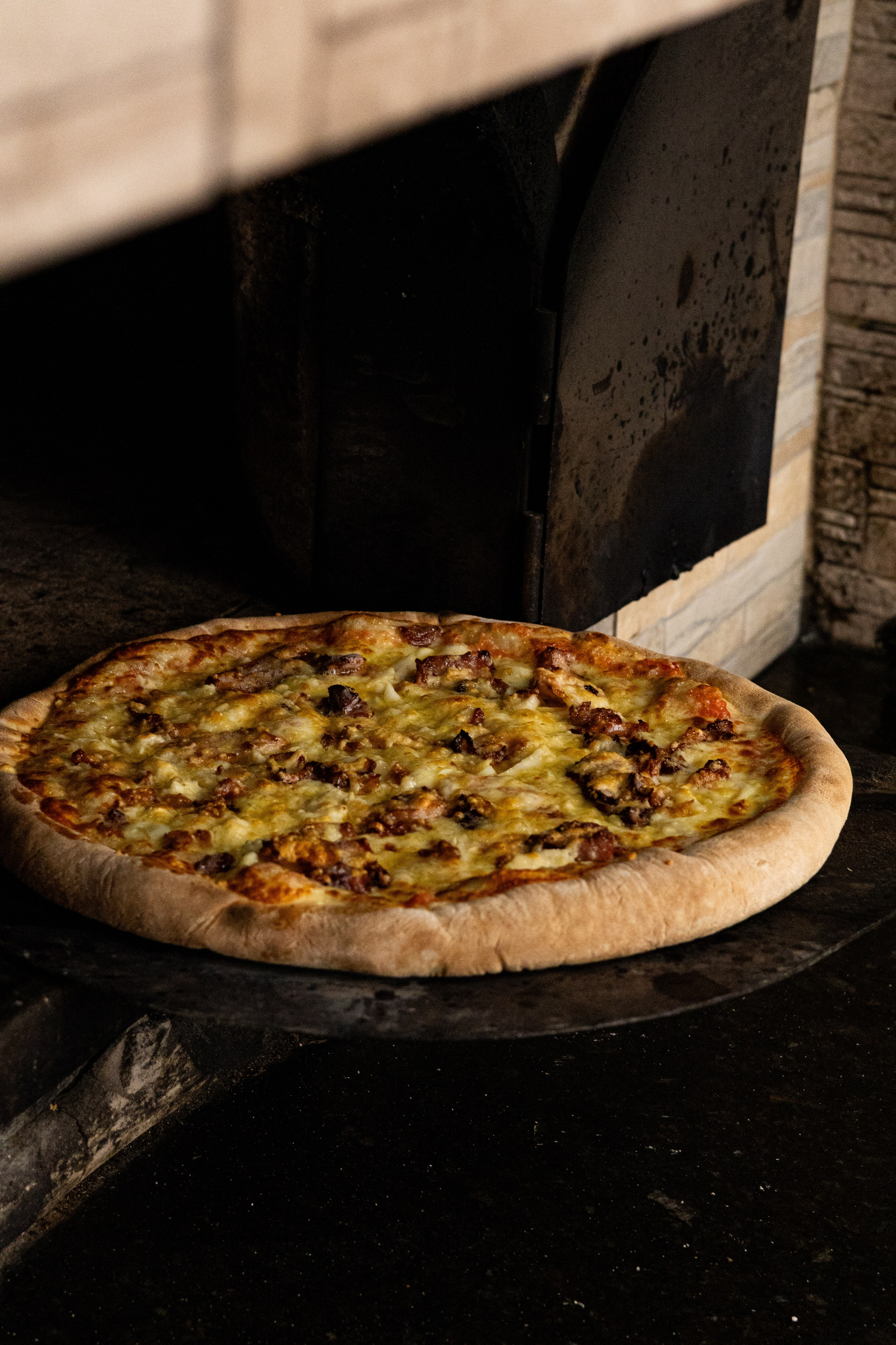 Captação de fotos profissionais em pizzaria forno a lenha