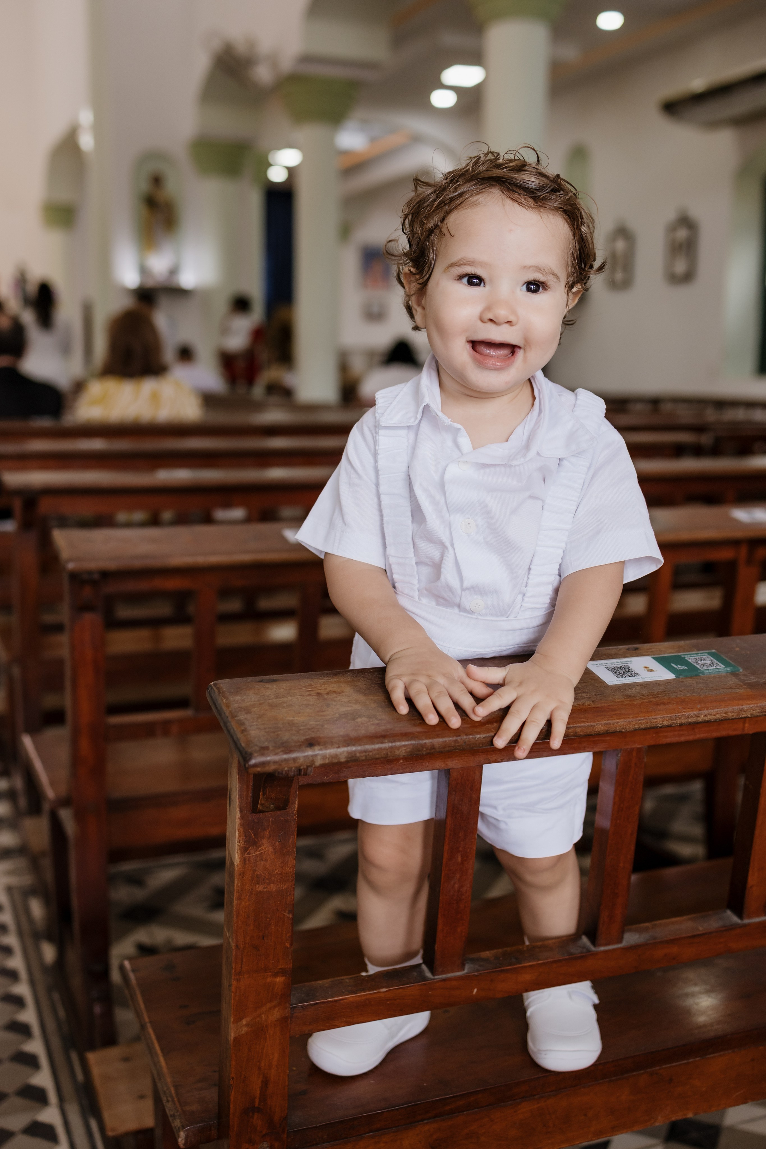 Expressão do bebê momentos após da cerimônia de batizado
