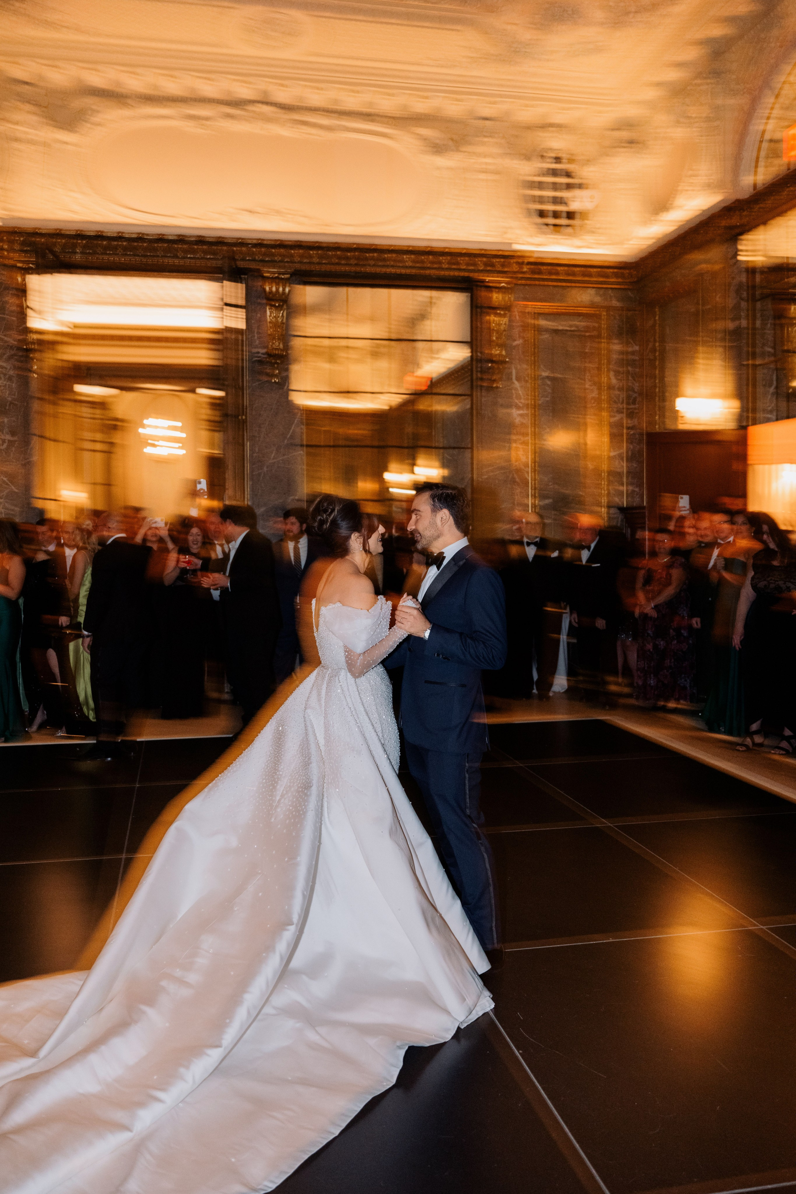 a bride and groom dancing on a dance floor