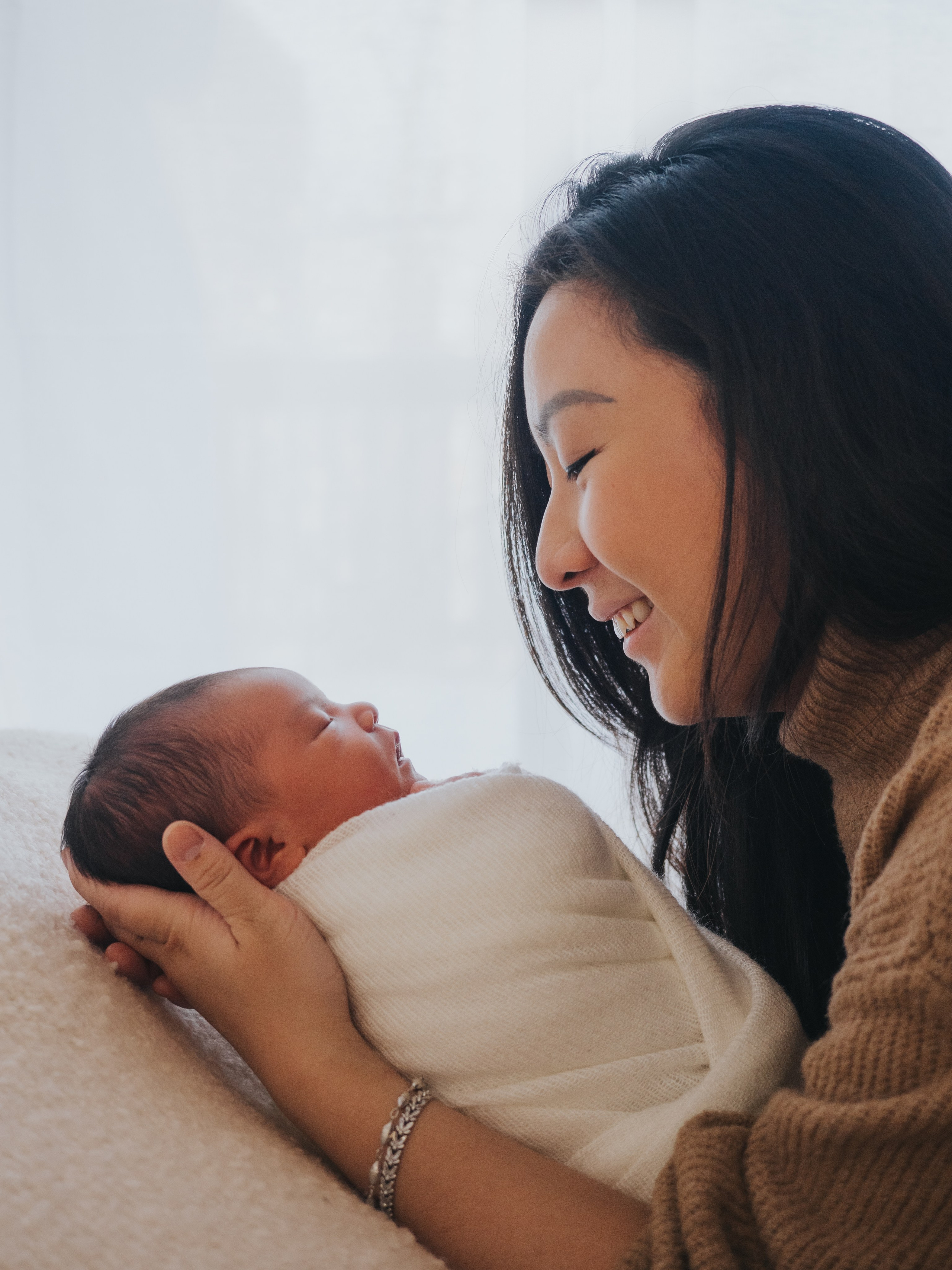 Mother looking at newborn