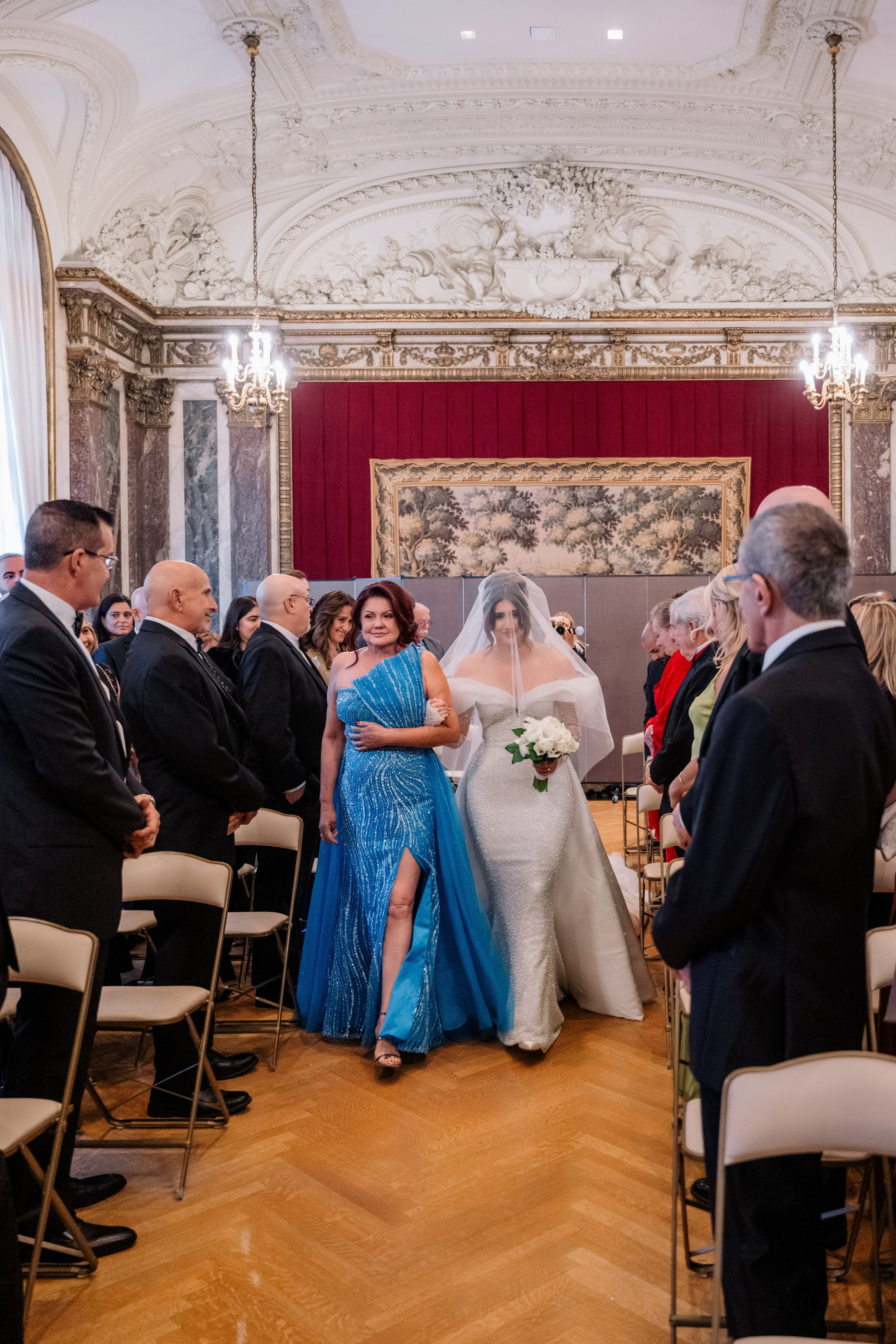 a bride and groom walking down the aisle