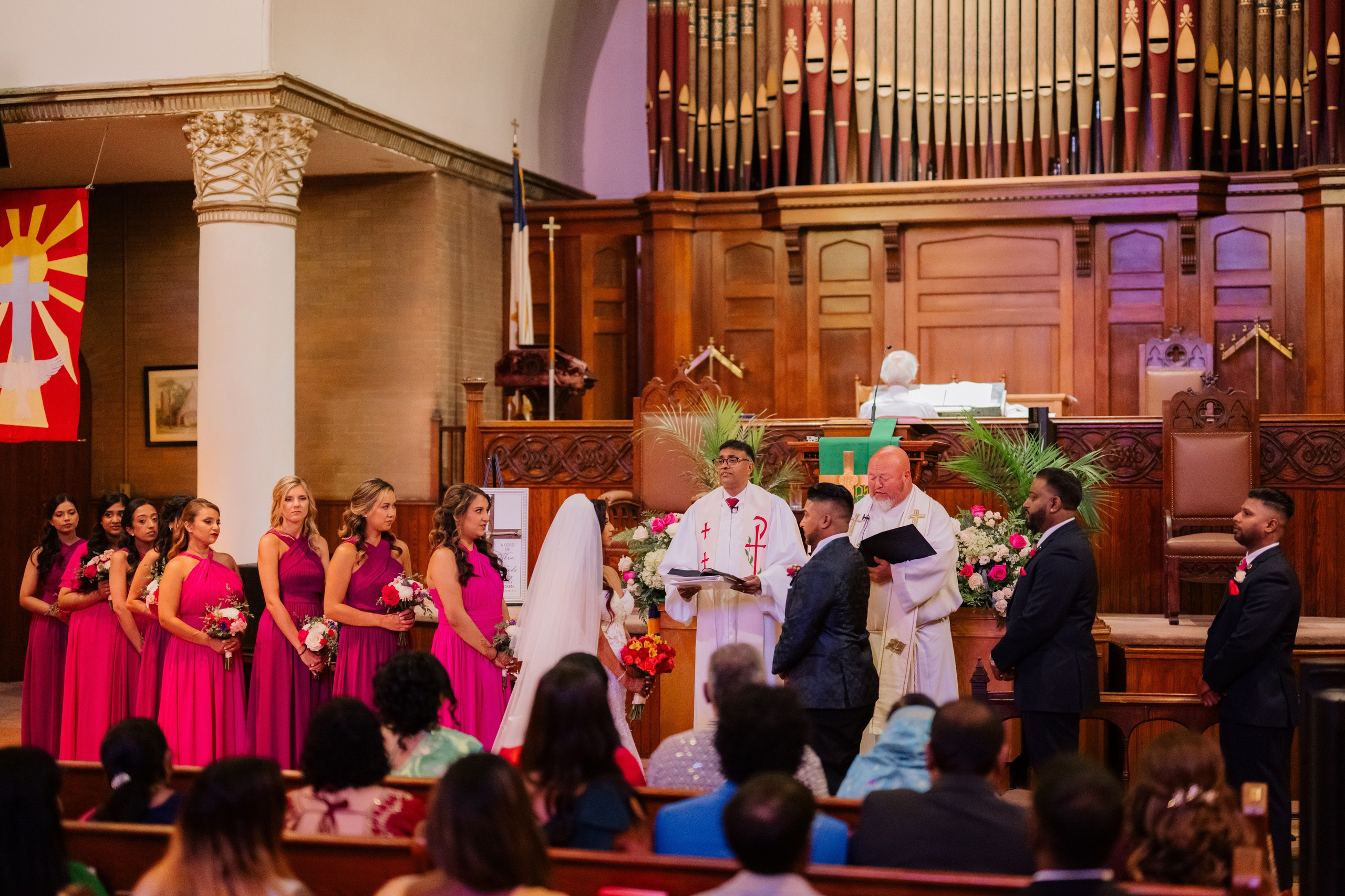 a group of people standing in a church