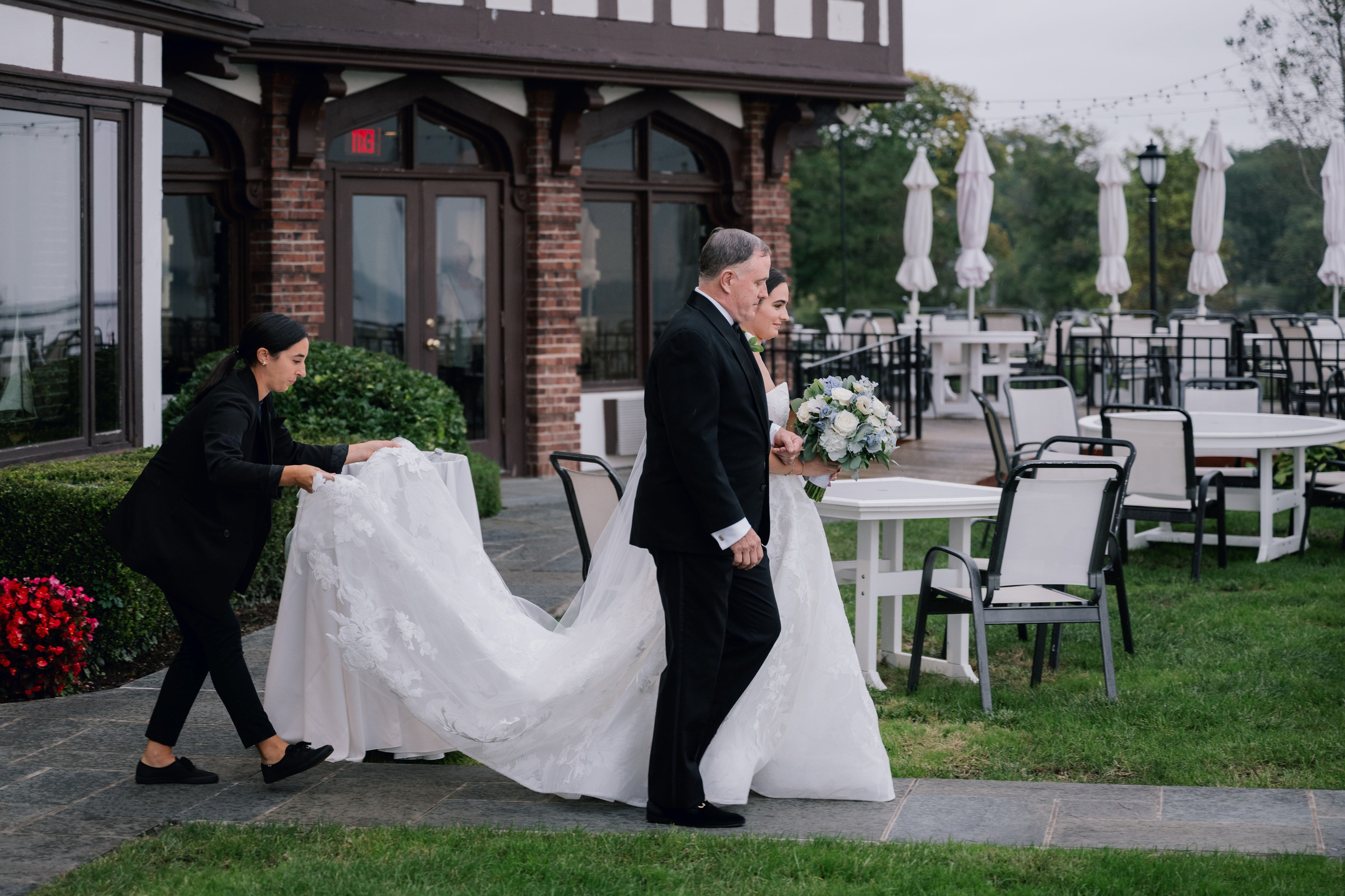 a bride and groom walking down the aisle