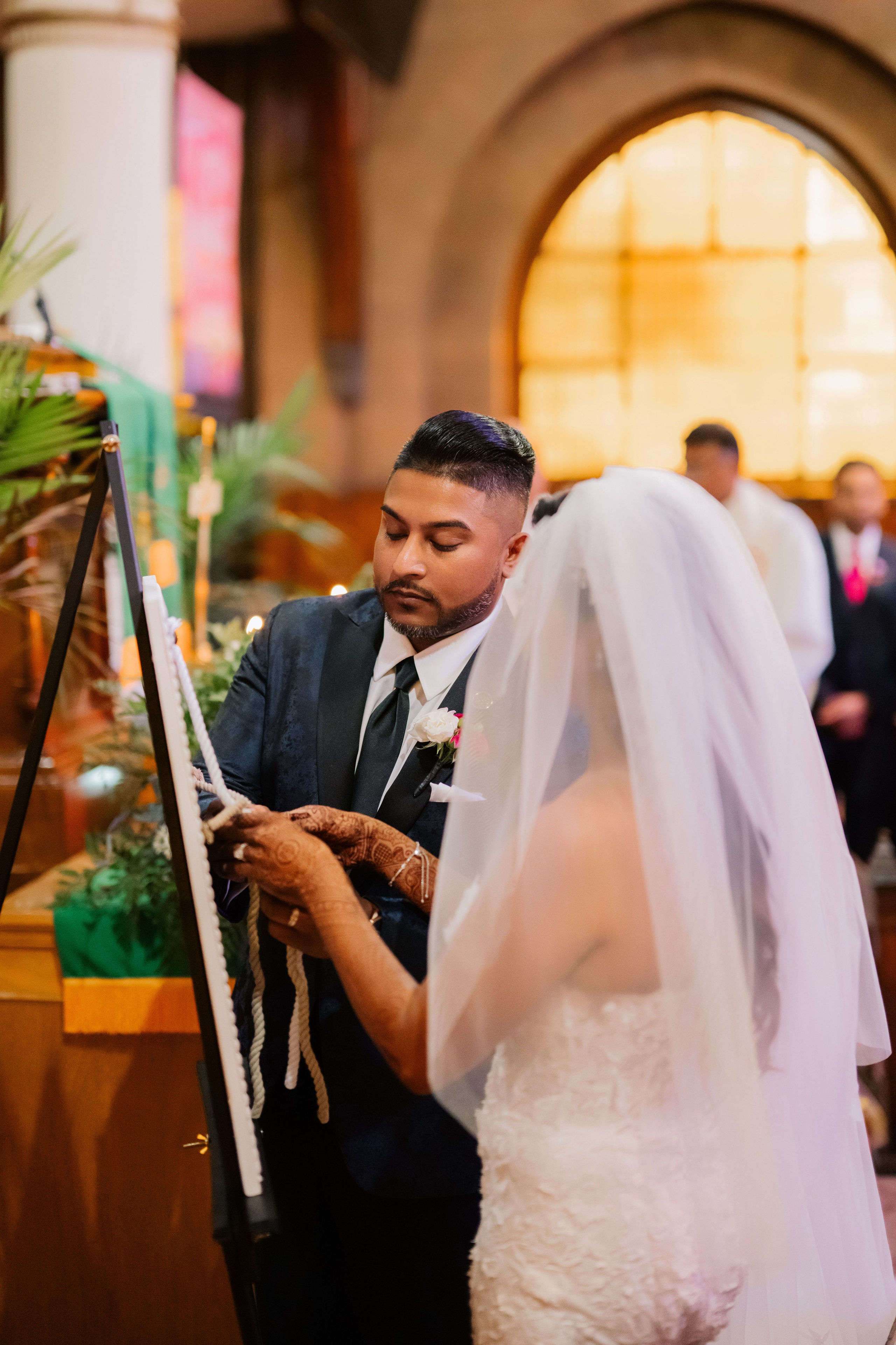 a man and woman are standing in a church