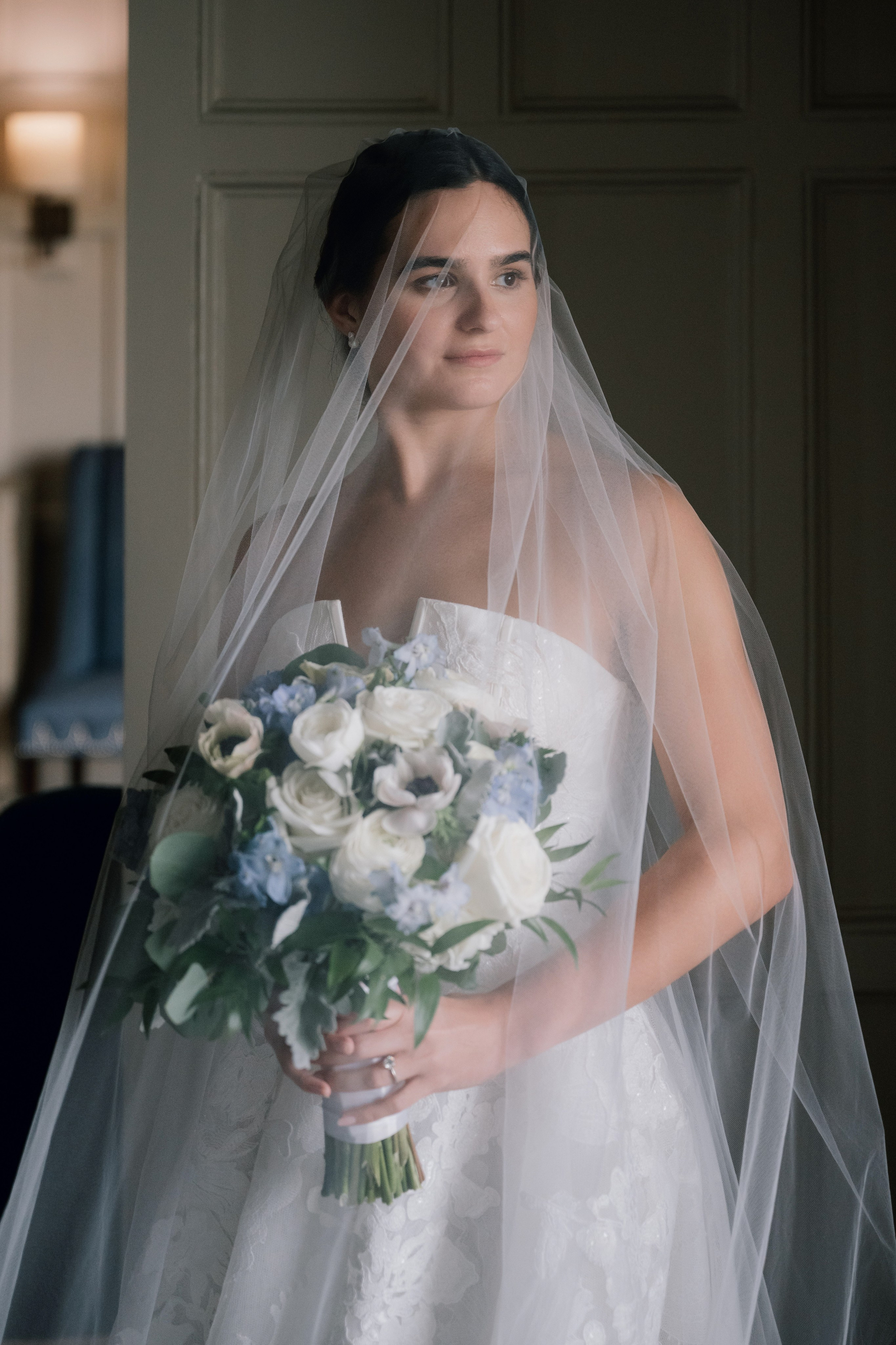 a bride holding a bouquet of flowers