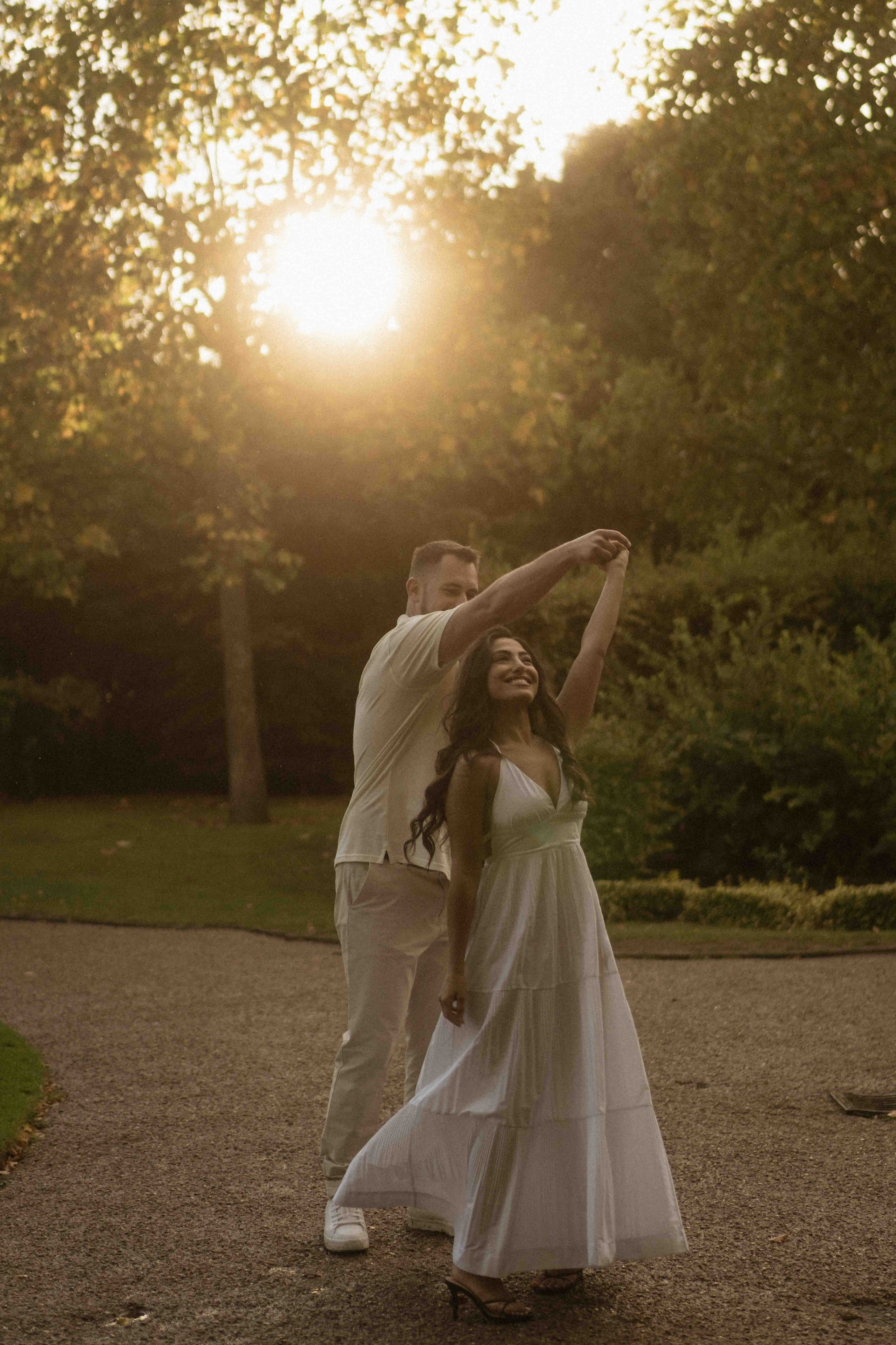 Couple walking in golden hour light after rain in Regent’s Park London