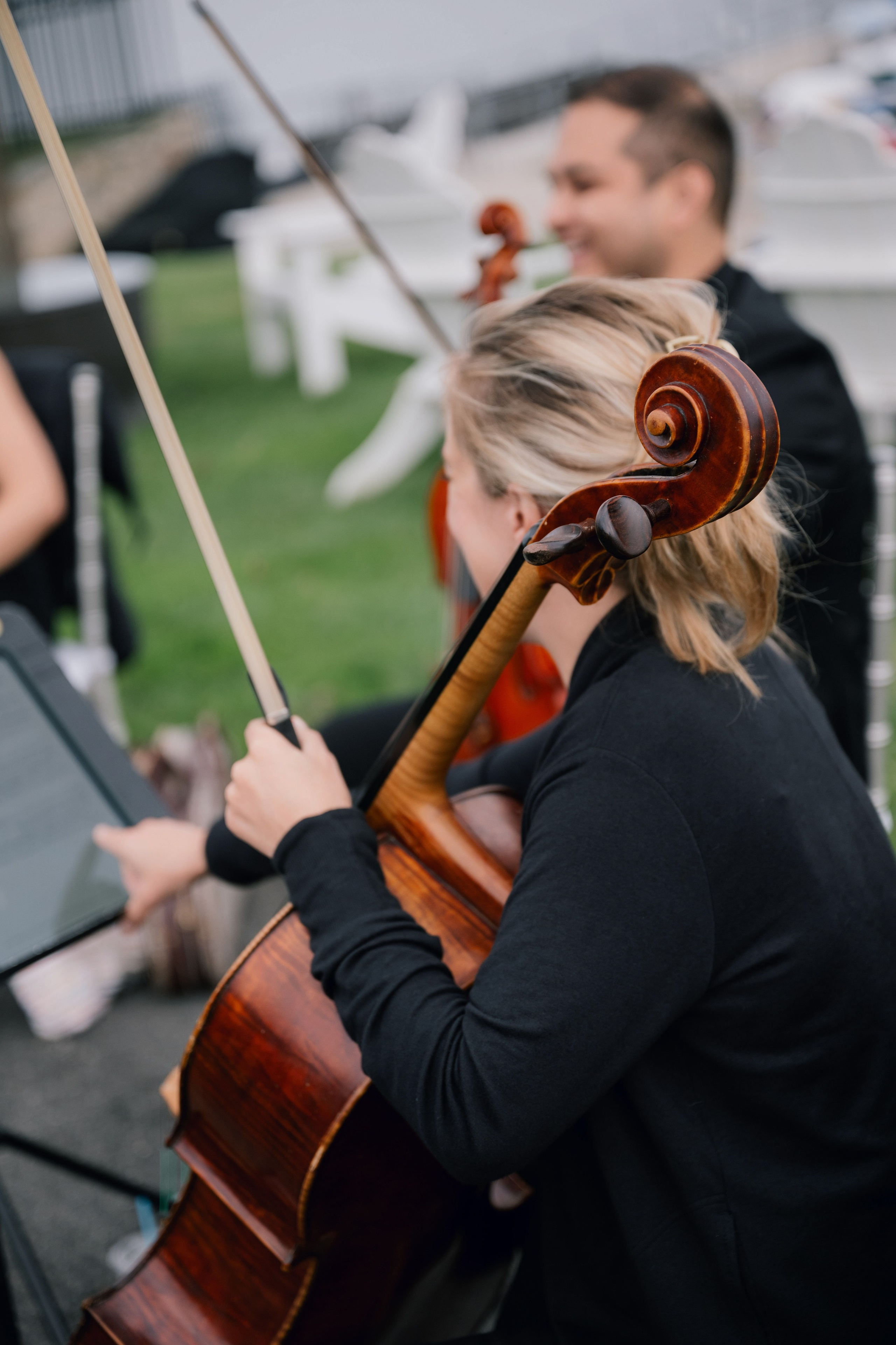 a woman playing a violin