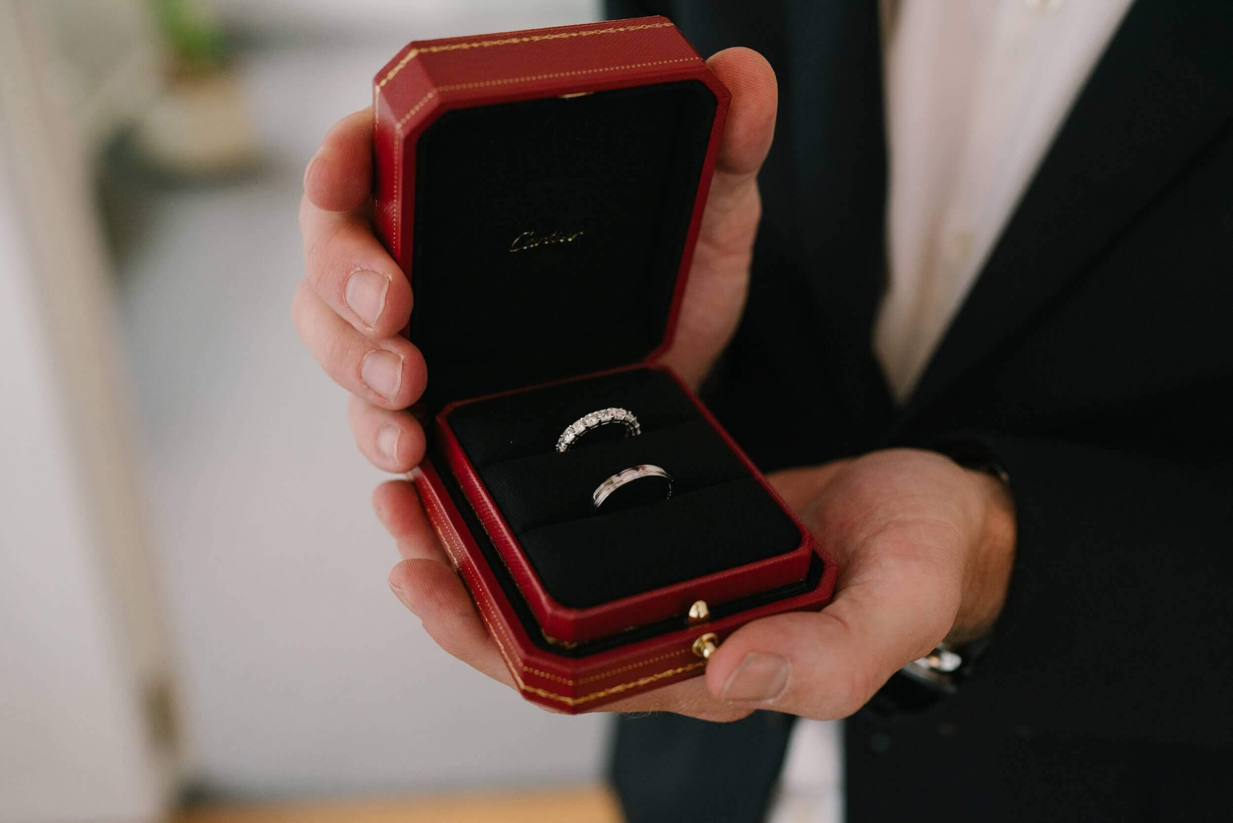 Wedding rings in red box during civil ceremony at Standesamt Grünwald