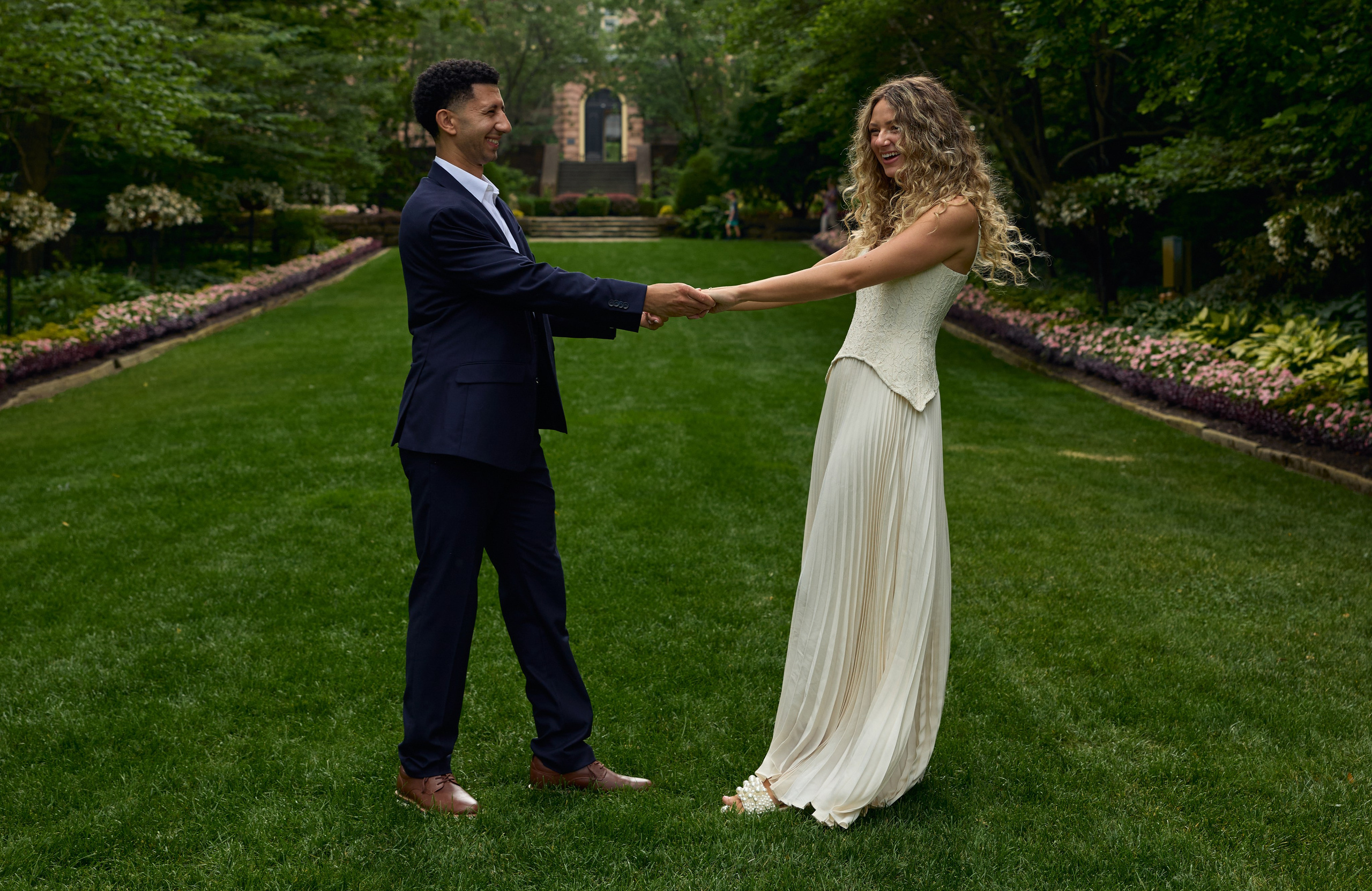 Couple holding hands on the lawn at Kingwood Center Gardens, Ohio