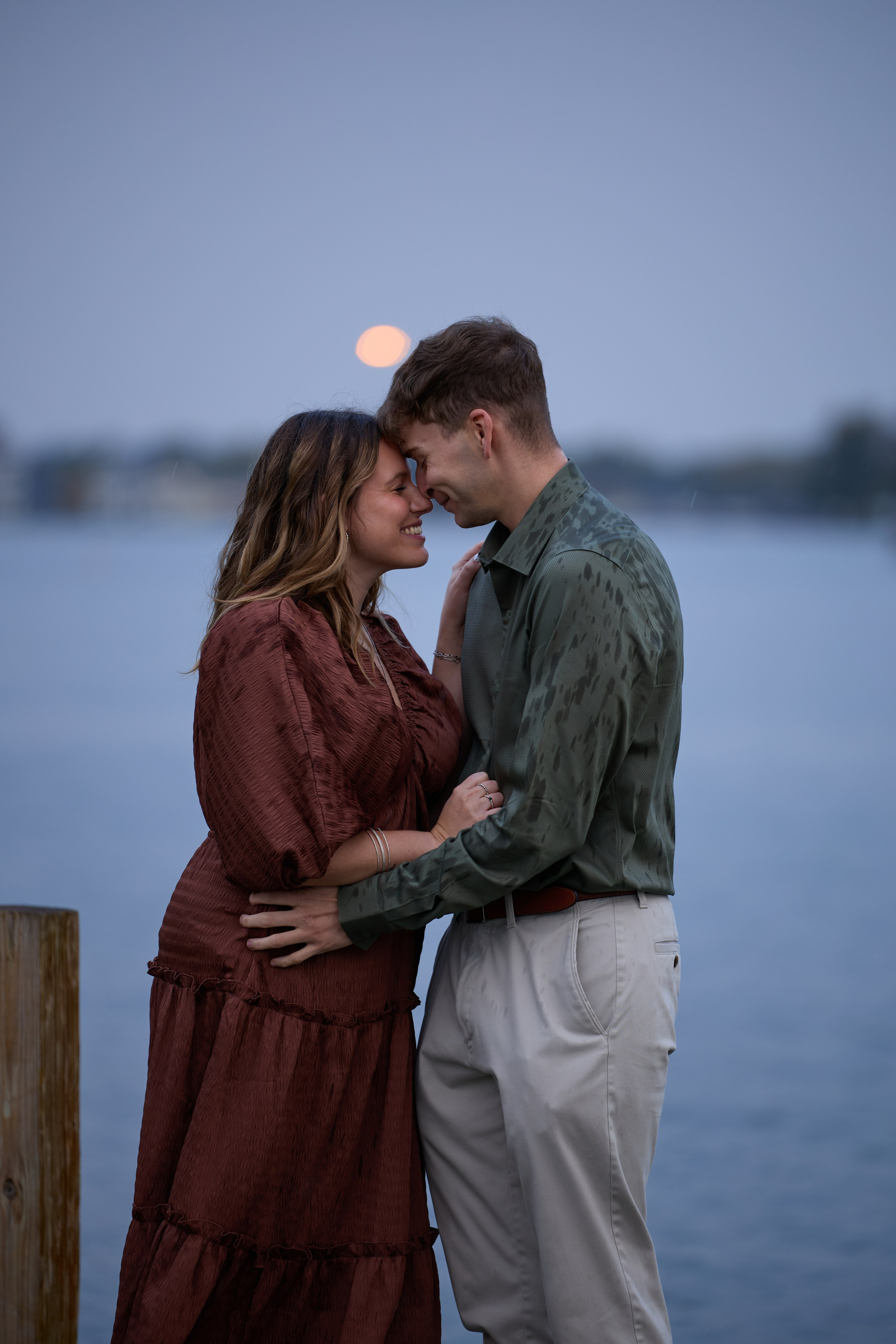 Foreheads touching at dusk on the dock at Buckeye Lake, Ohio