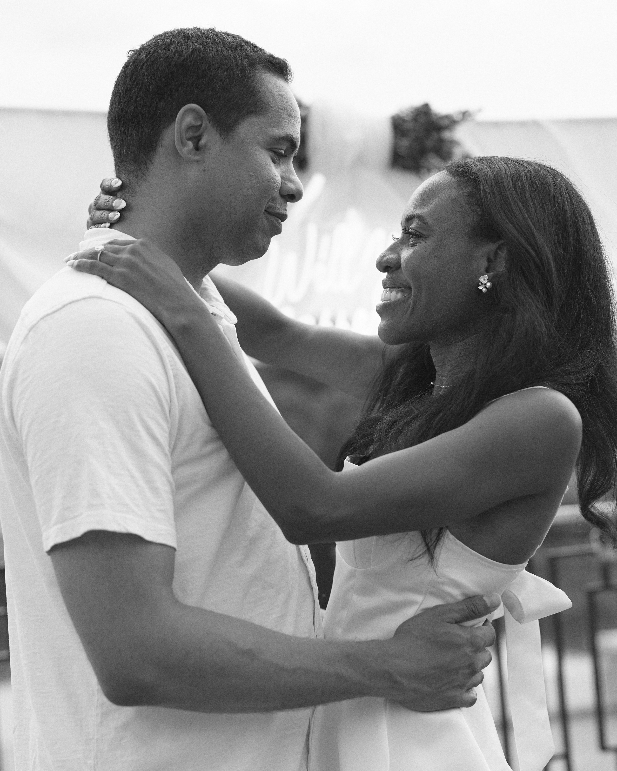 Black and white portrait of a smiling couple embracing after the proposal in Columbus, Ohio