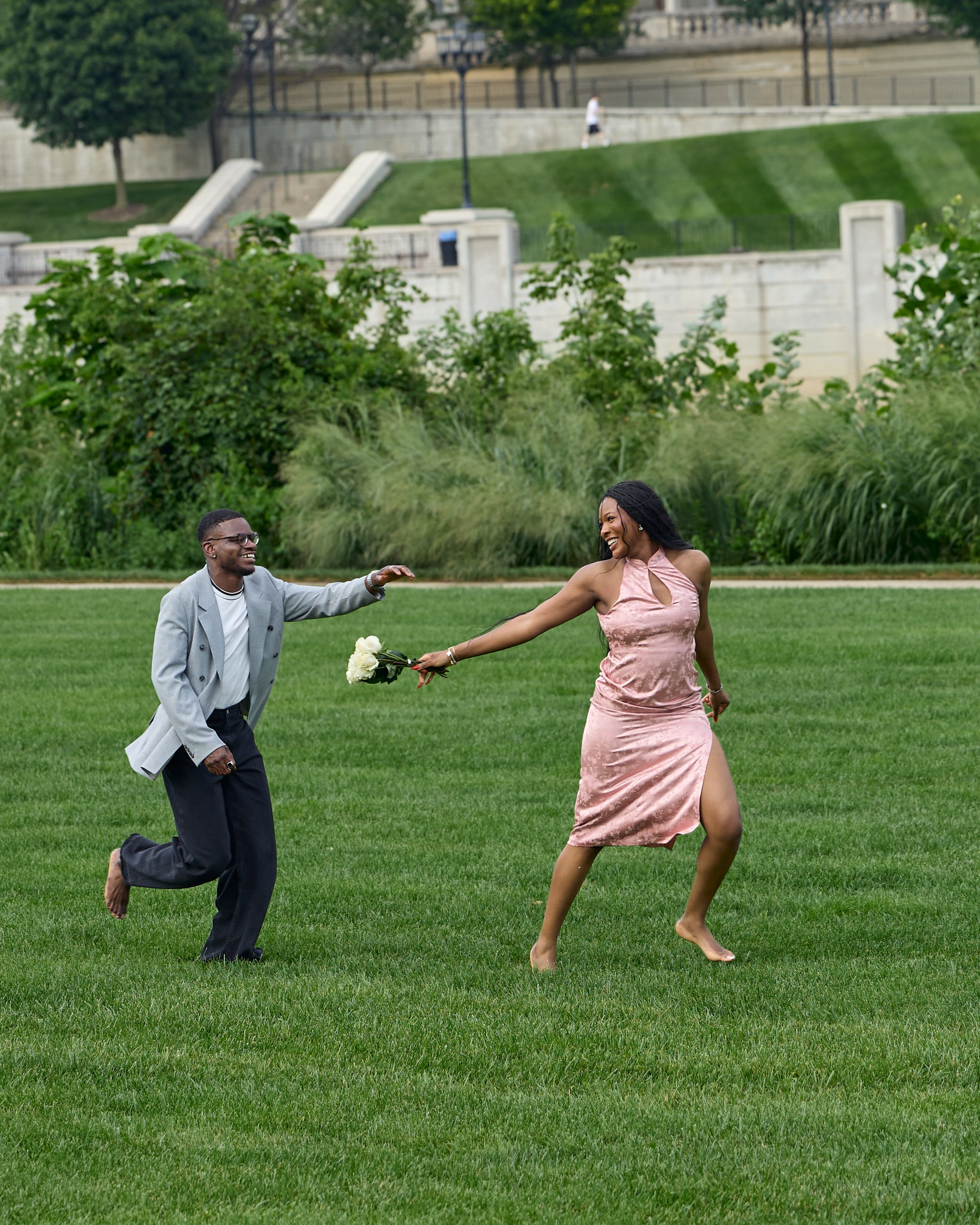 Joyful dance on the grass with a bouquet in downtown Columbus, Ohio