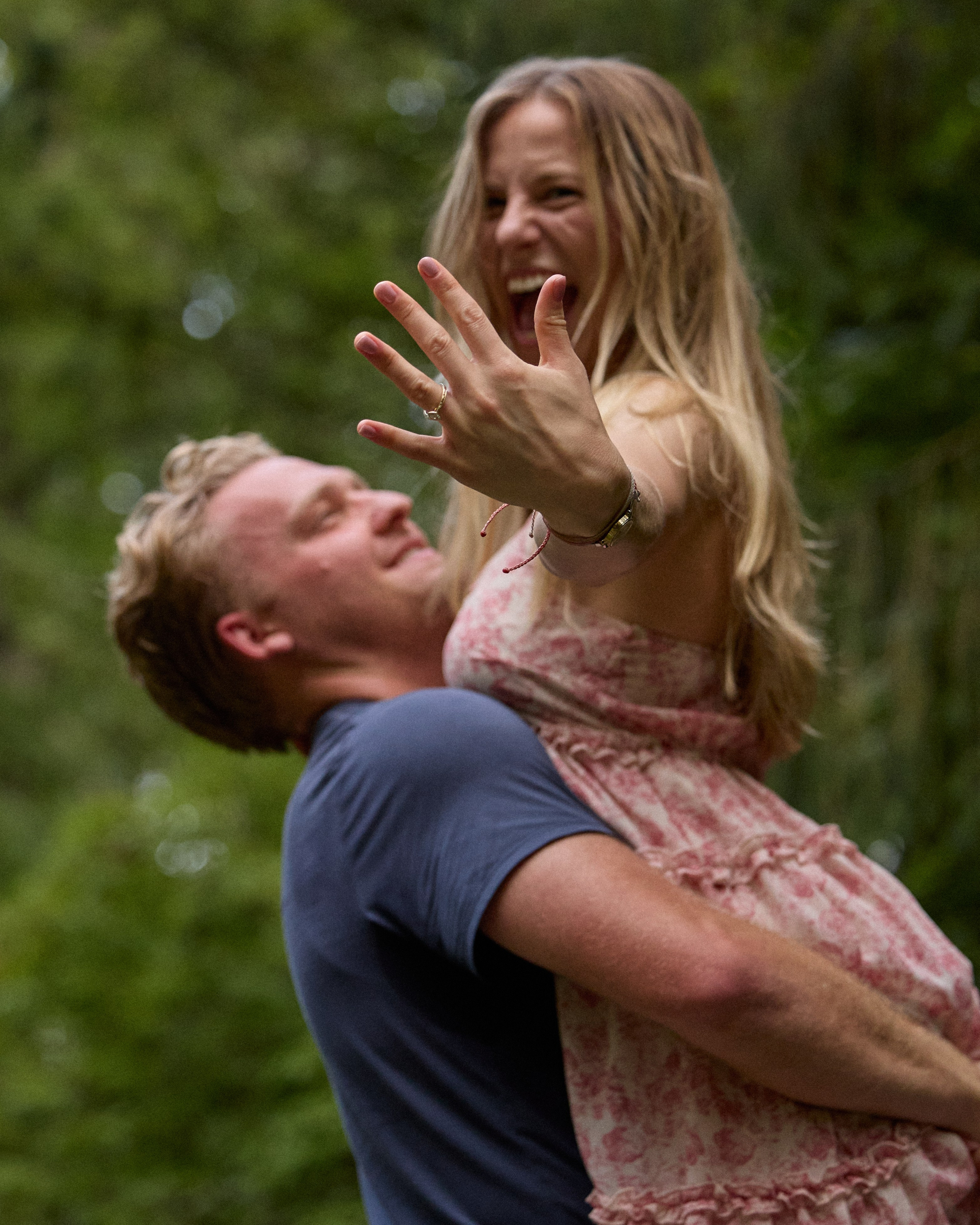 Close-up of a new fiancée showing her ring while being lifted at Inniswood Metro Gardens, Ohio