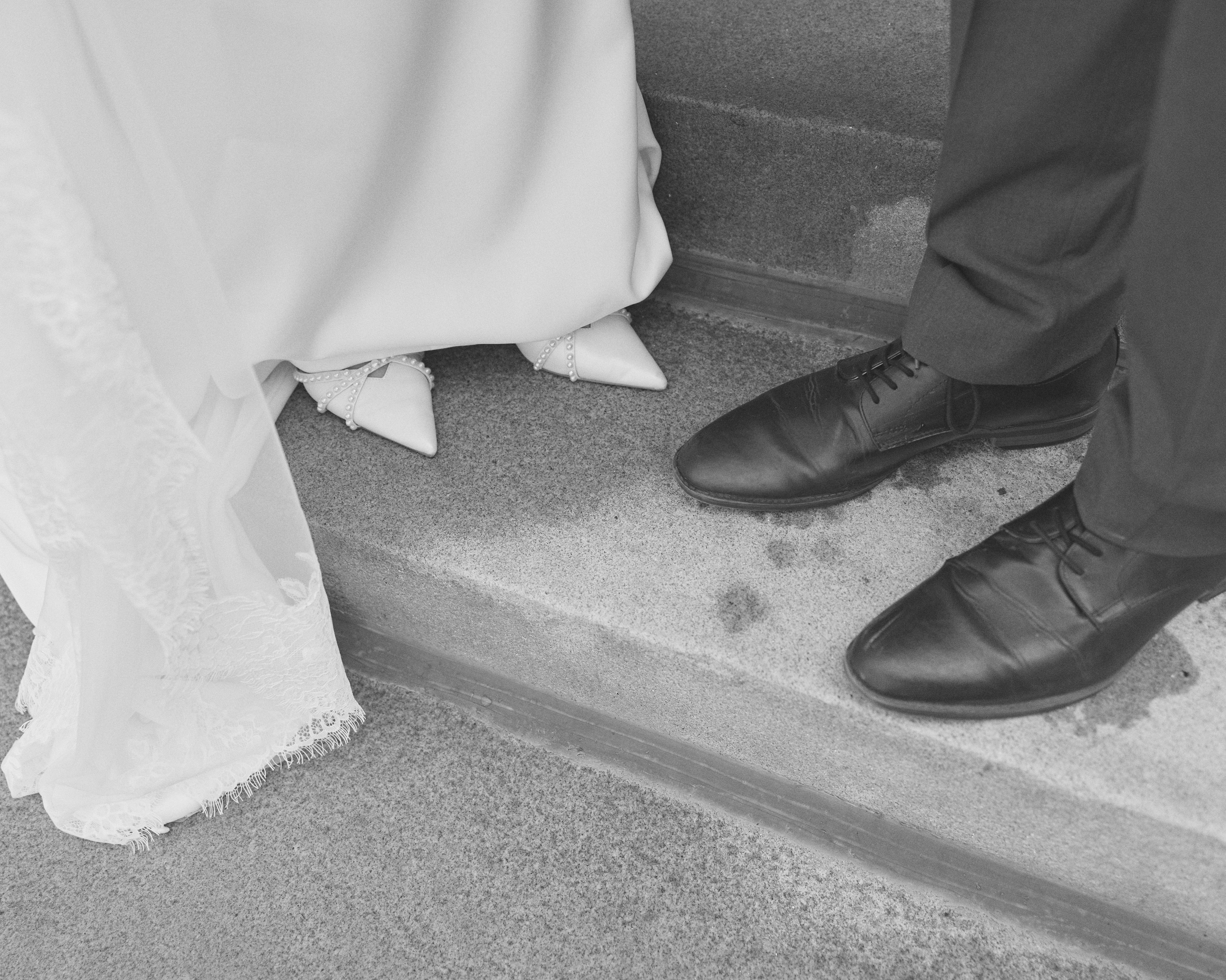 Black and white detail of wedding shoes and dress hem in Columbus, Ohio
