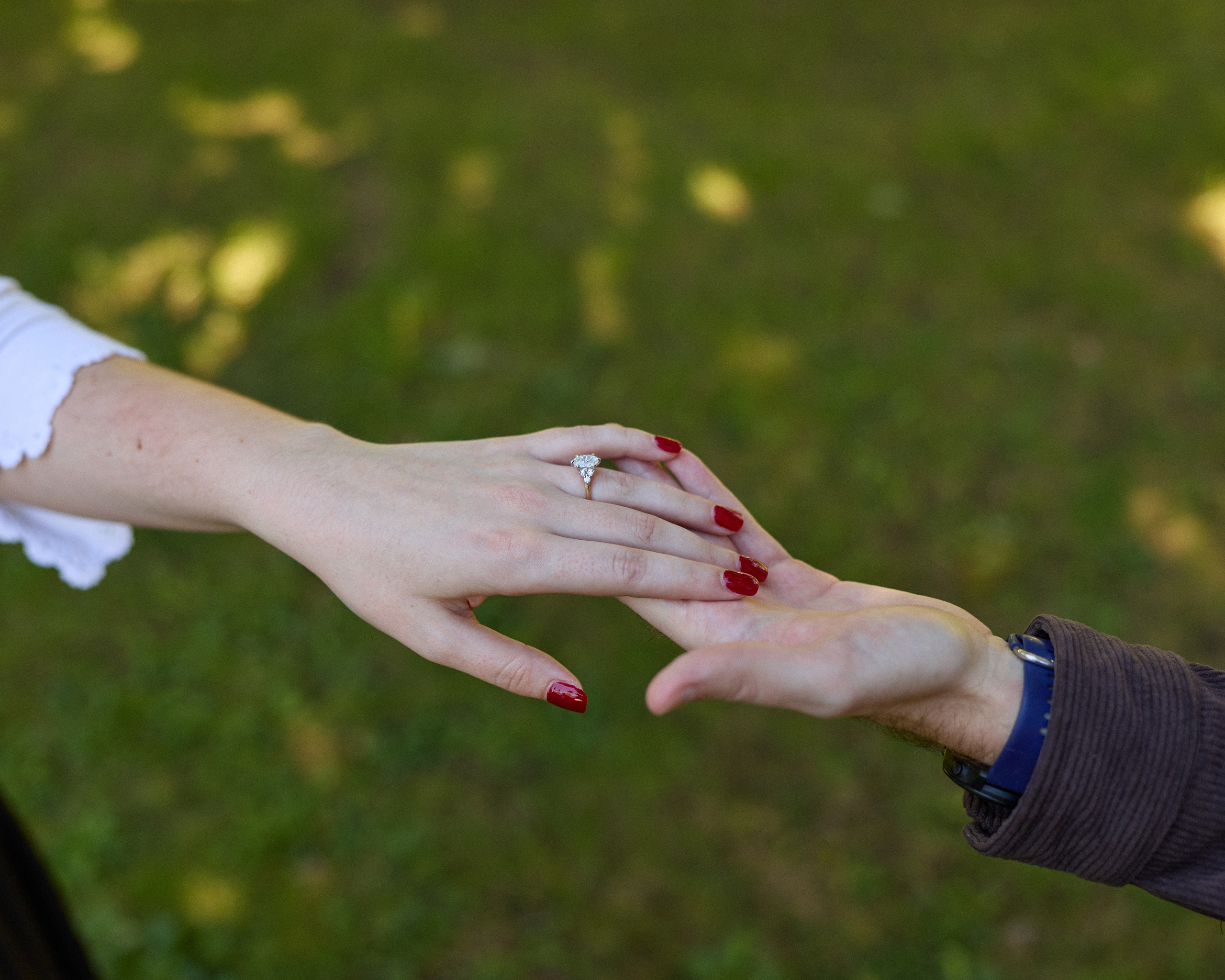 Close-up of intertwined hands showing the new engagement ring in Columbus, Ohio