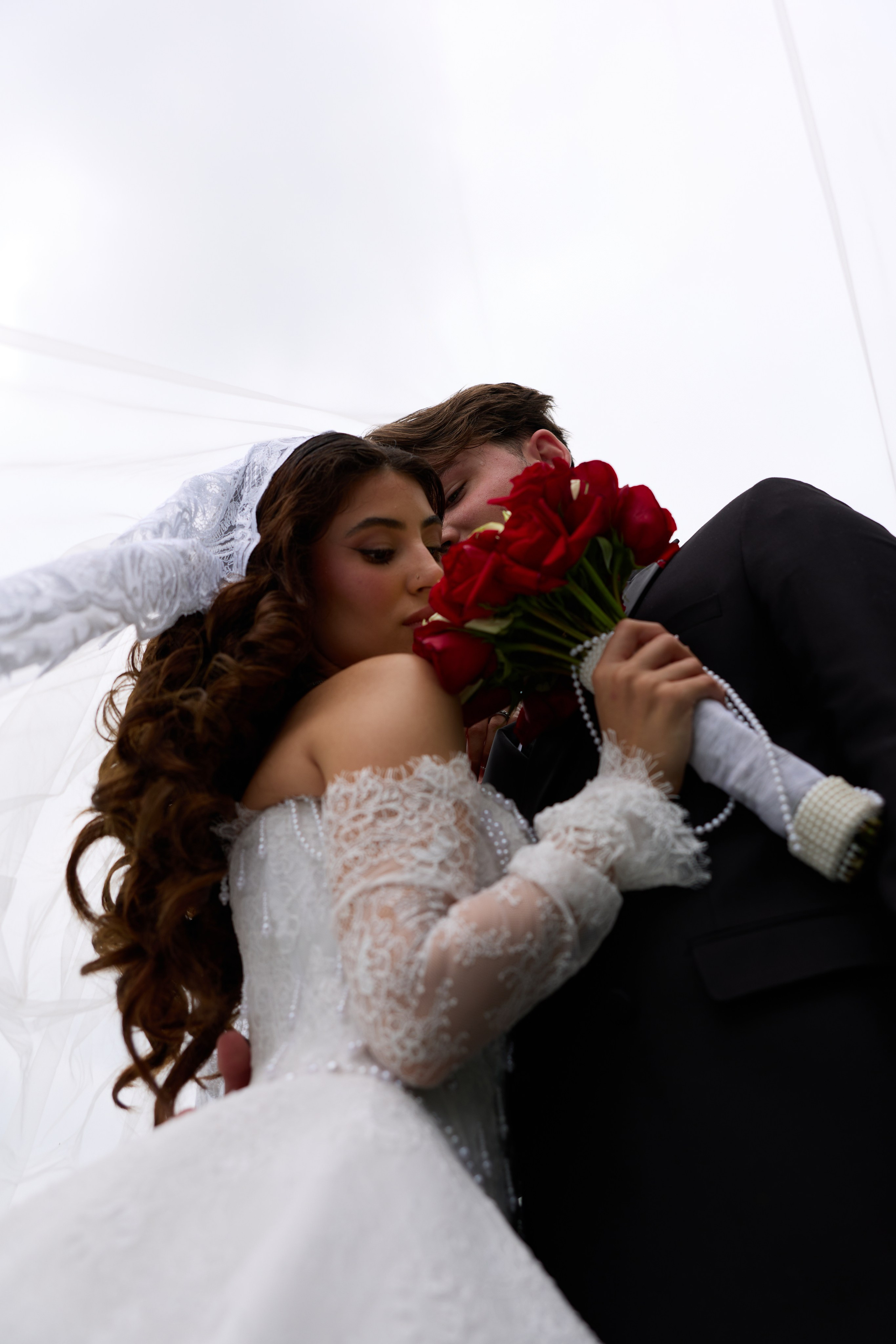 Newlyweds holding hands during romantic portraits in Columbus Ohio