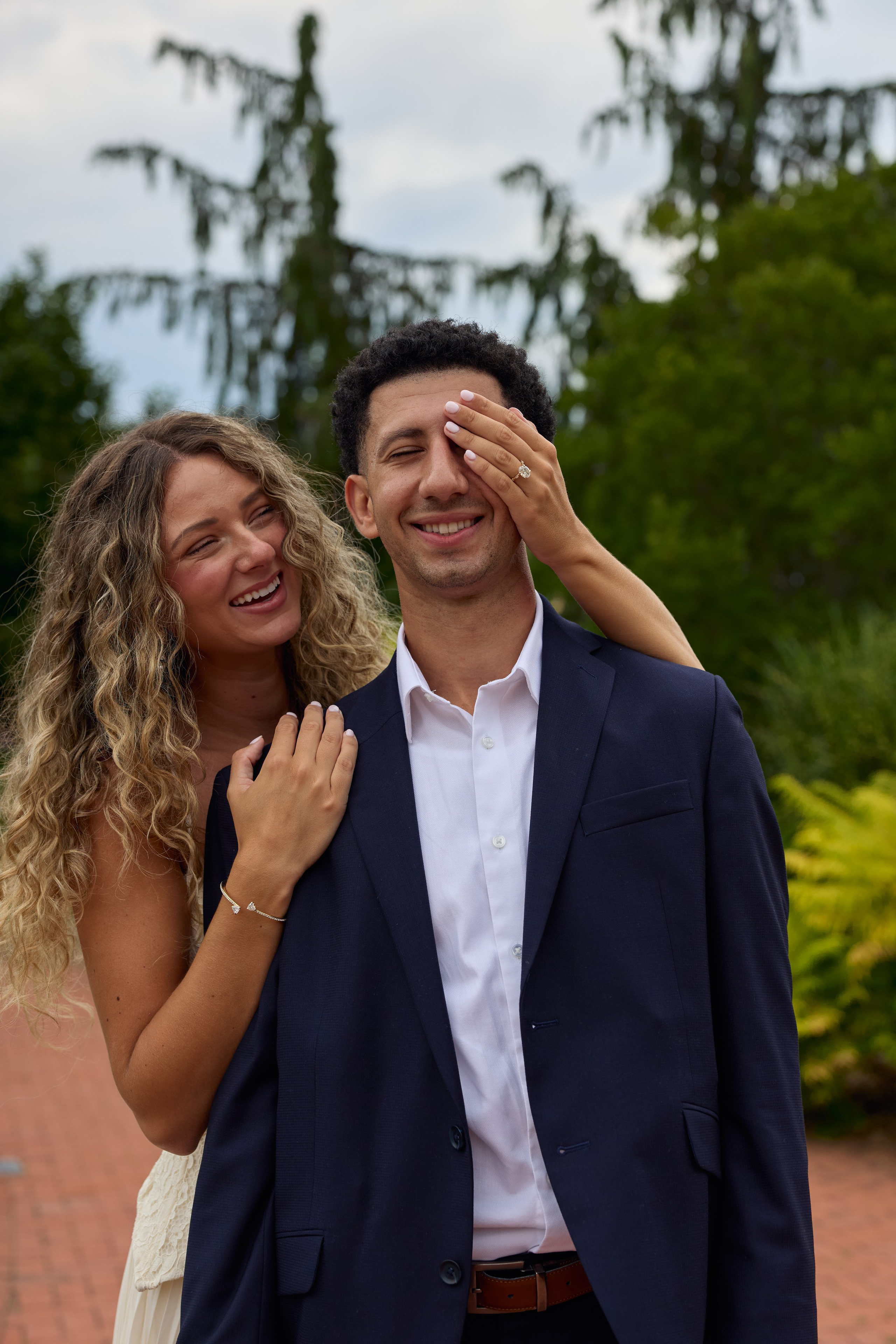 Playful moment with her hands over his eyes at Kingwood Center Gardens, Ohio