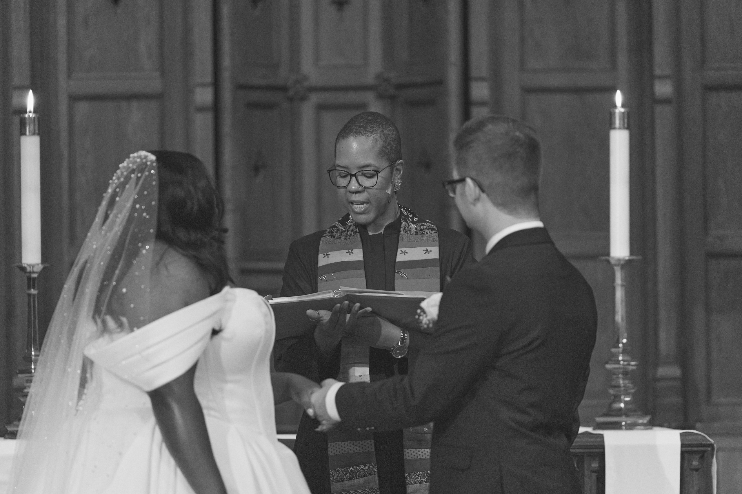 Bride and groom surrounded by family during intimate wedding celebration