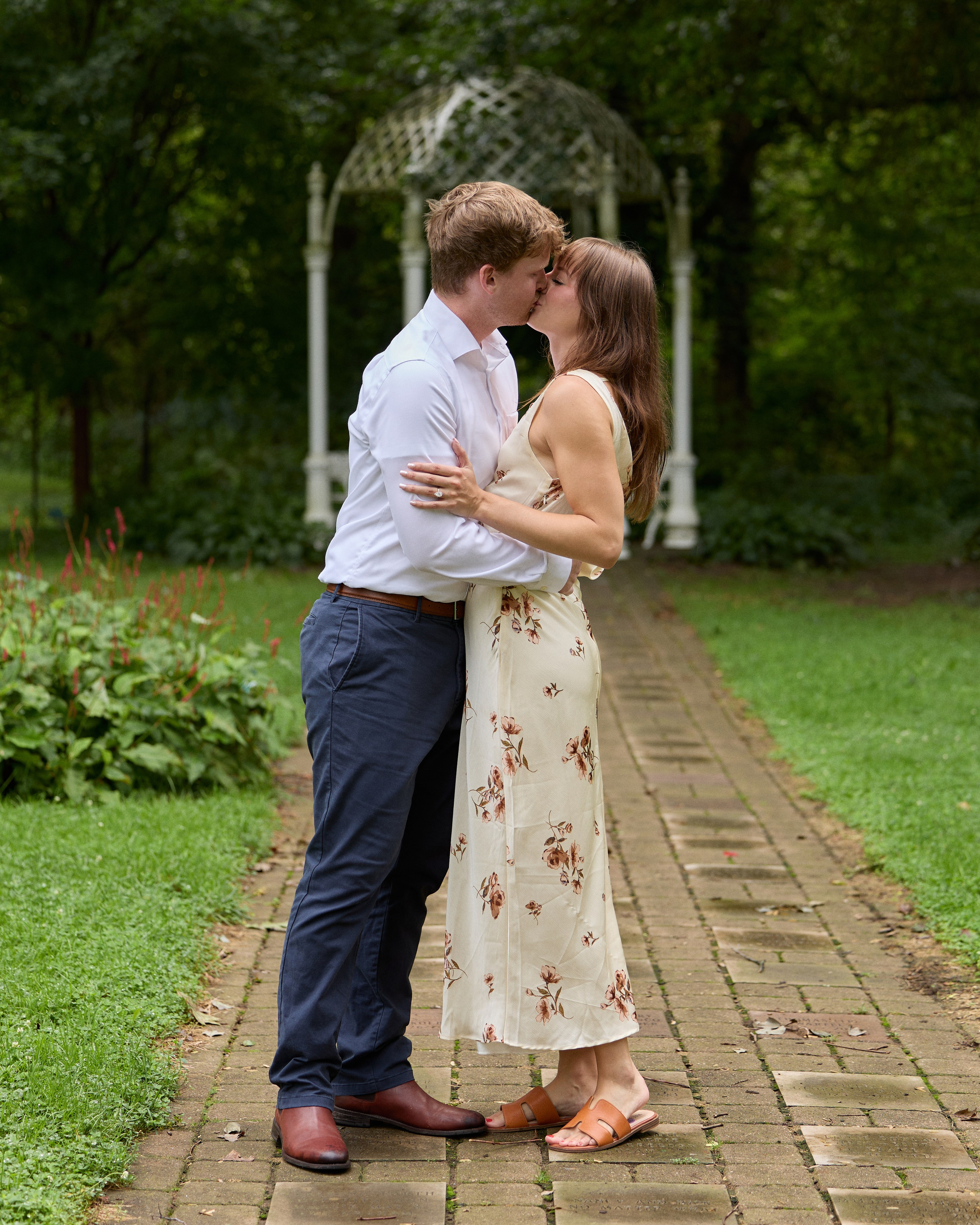 Joyful laughter after a gazebo proposal at the Park of Roses in Columbus, Ohio