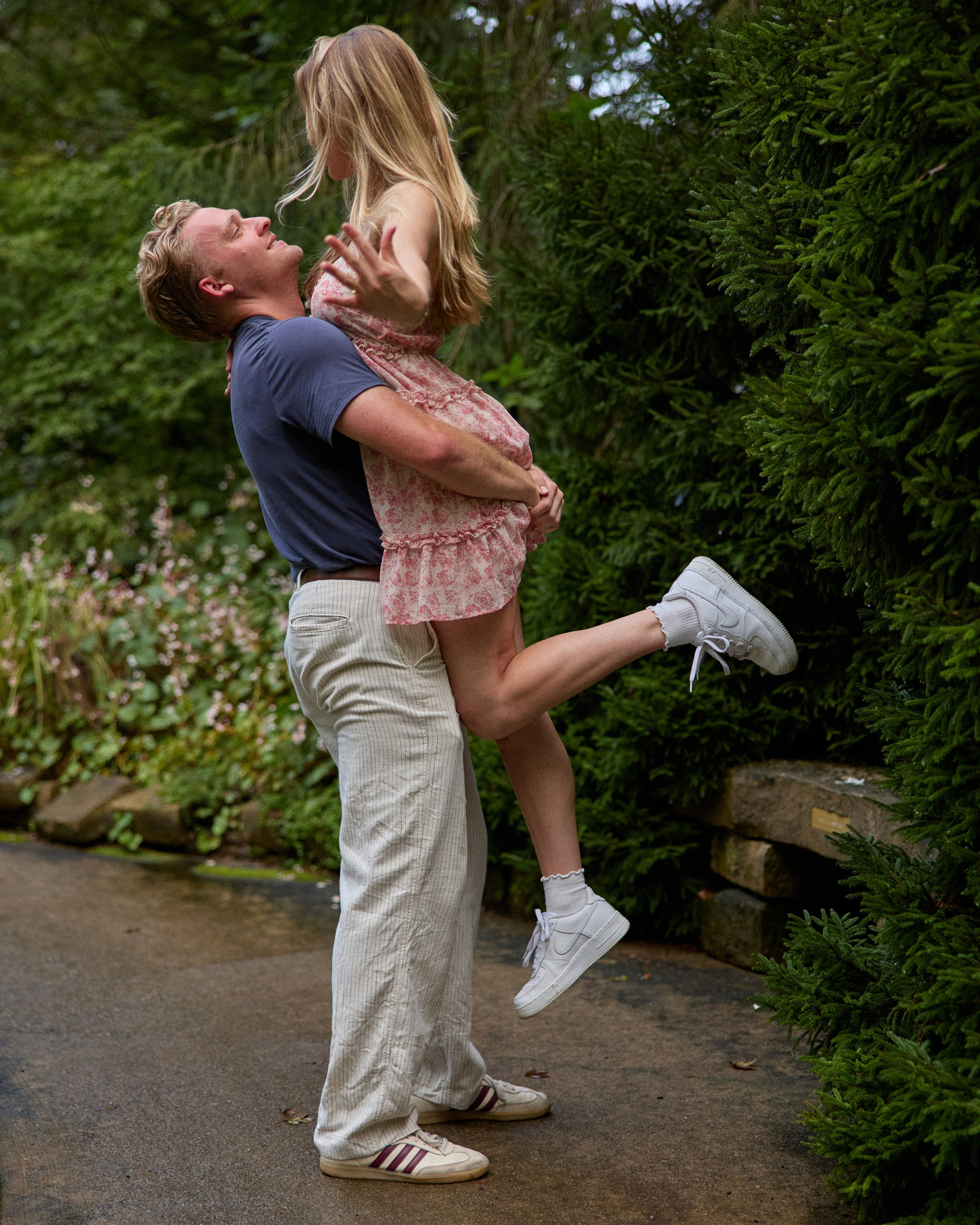 Joyful lift with her shoe flying off after a proposal at Inniswood Metro Gardens, Ohio