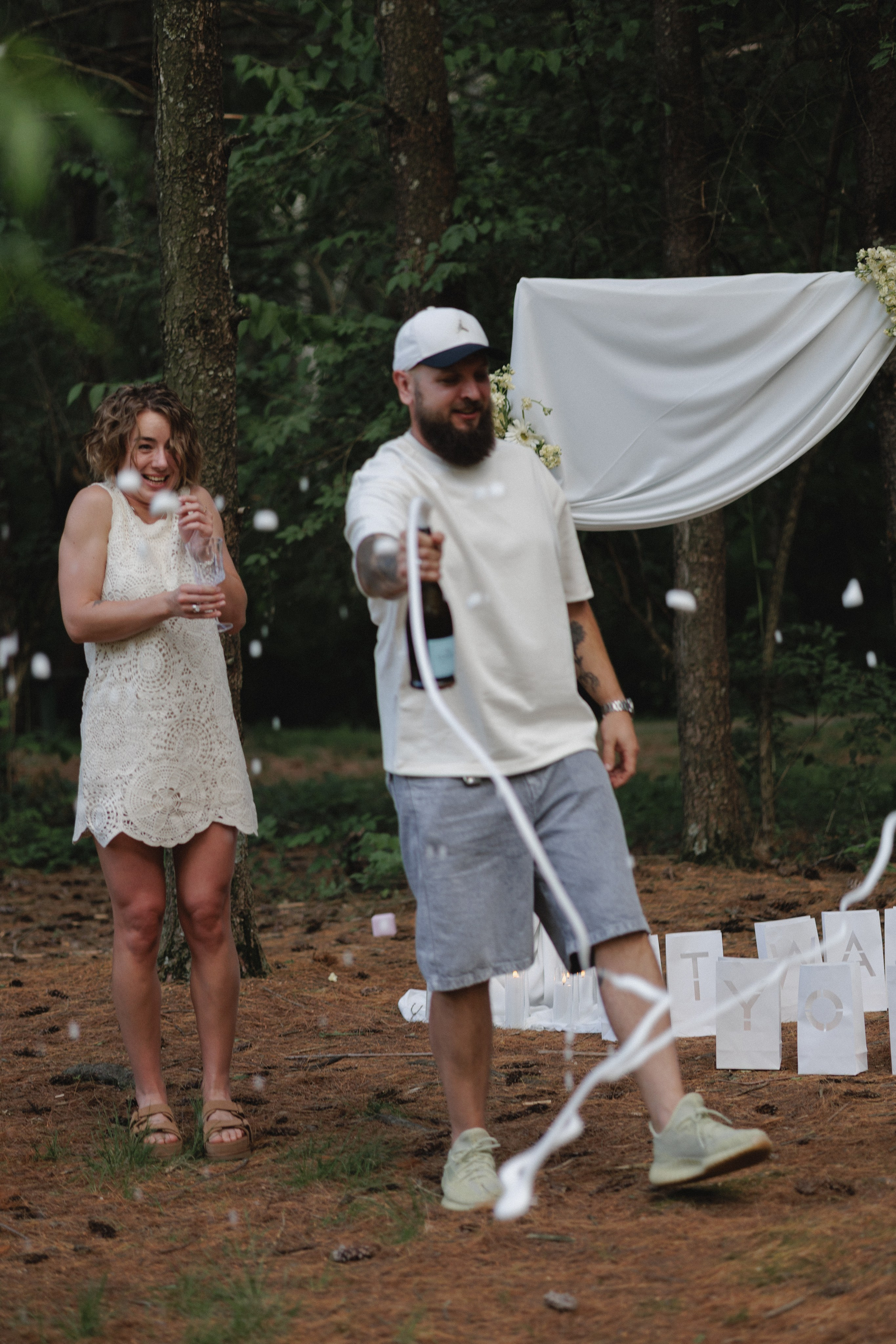 Playful champagne celebration in the woods near Columbus, Ohio