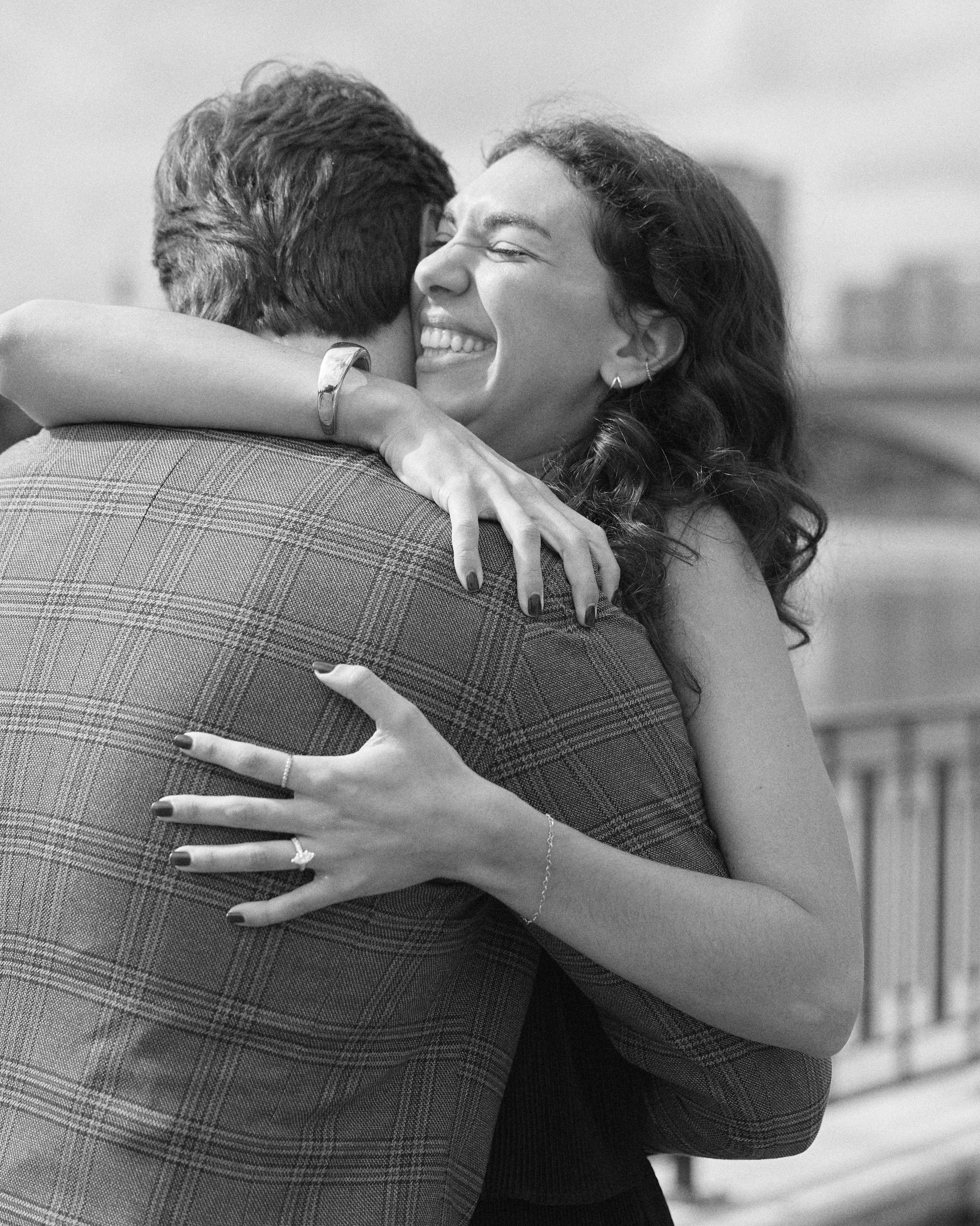 Black and white close-up of an emotional hug after the proposal in Columbus, Ohio