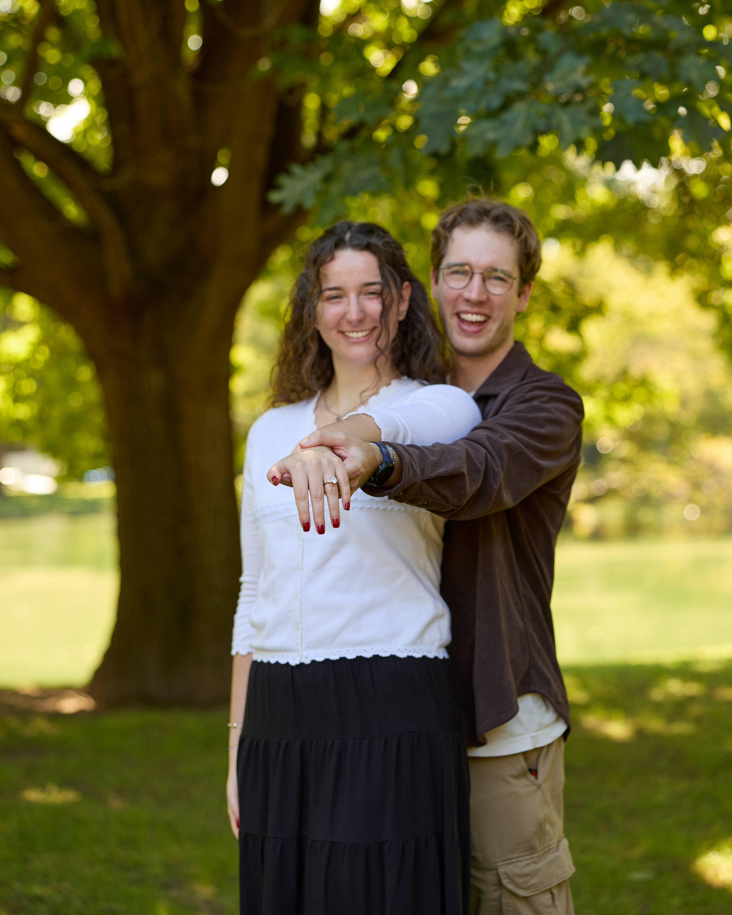 Happy couple portrait beneath a big tree in Columbus, Ohio