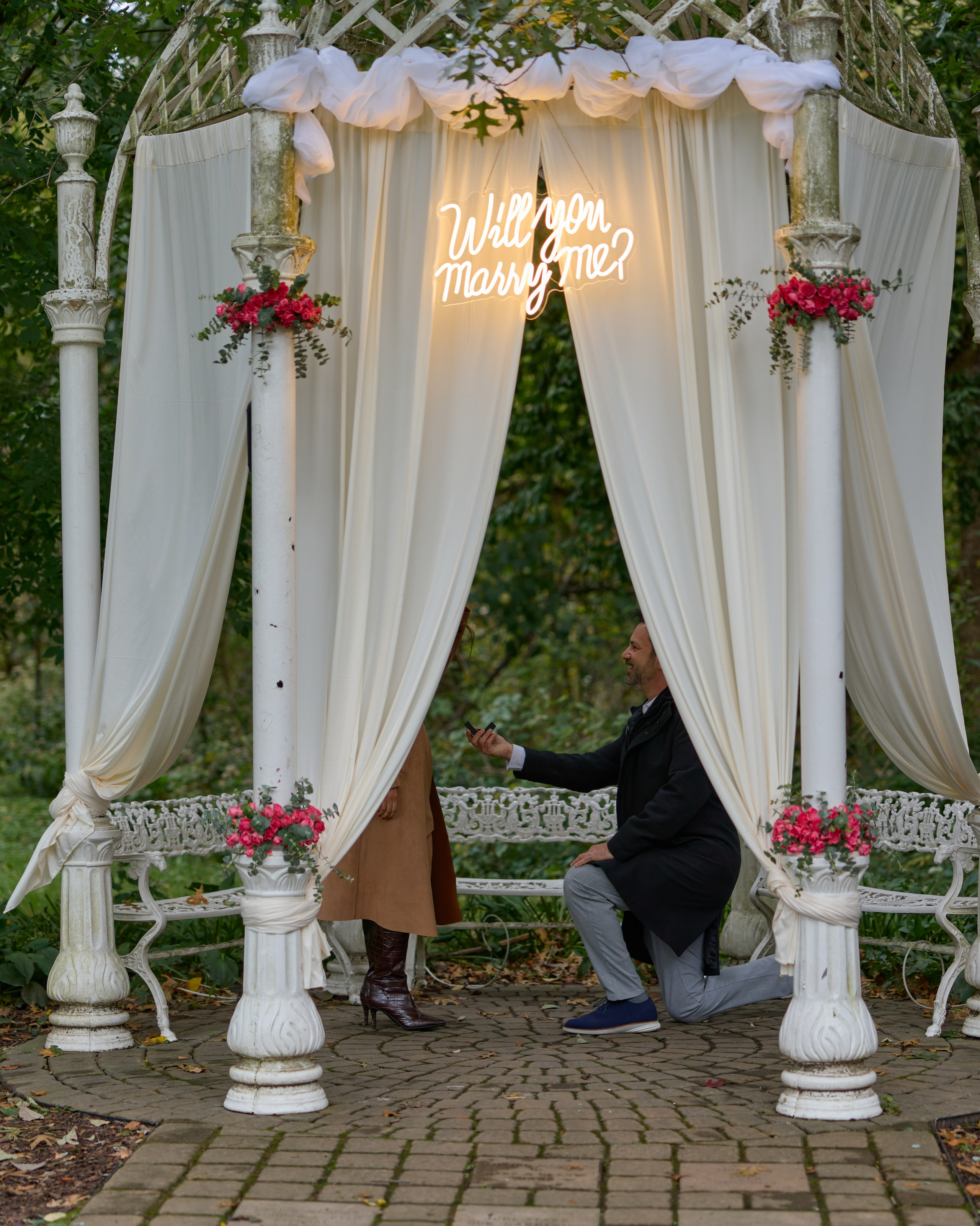 Floral proposal setup under a draped gazebo at the Park of Roses in Columbus, Ohio