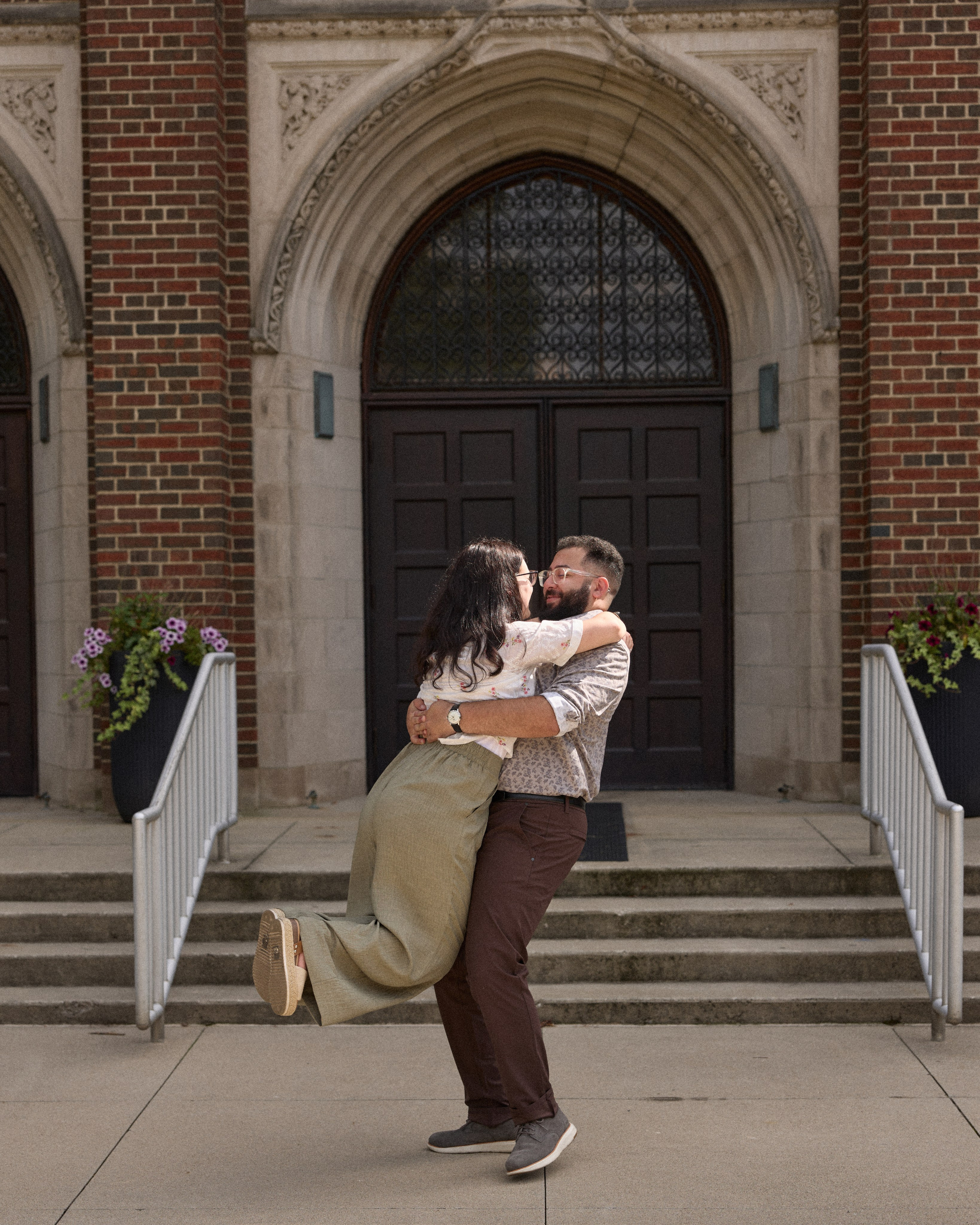 Lift and kiss on the university steps in Columbus, Ohio