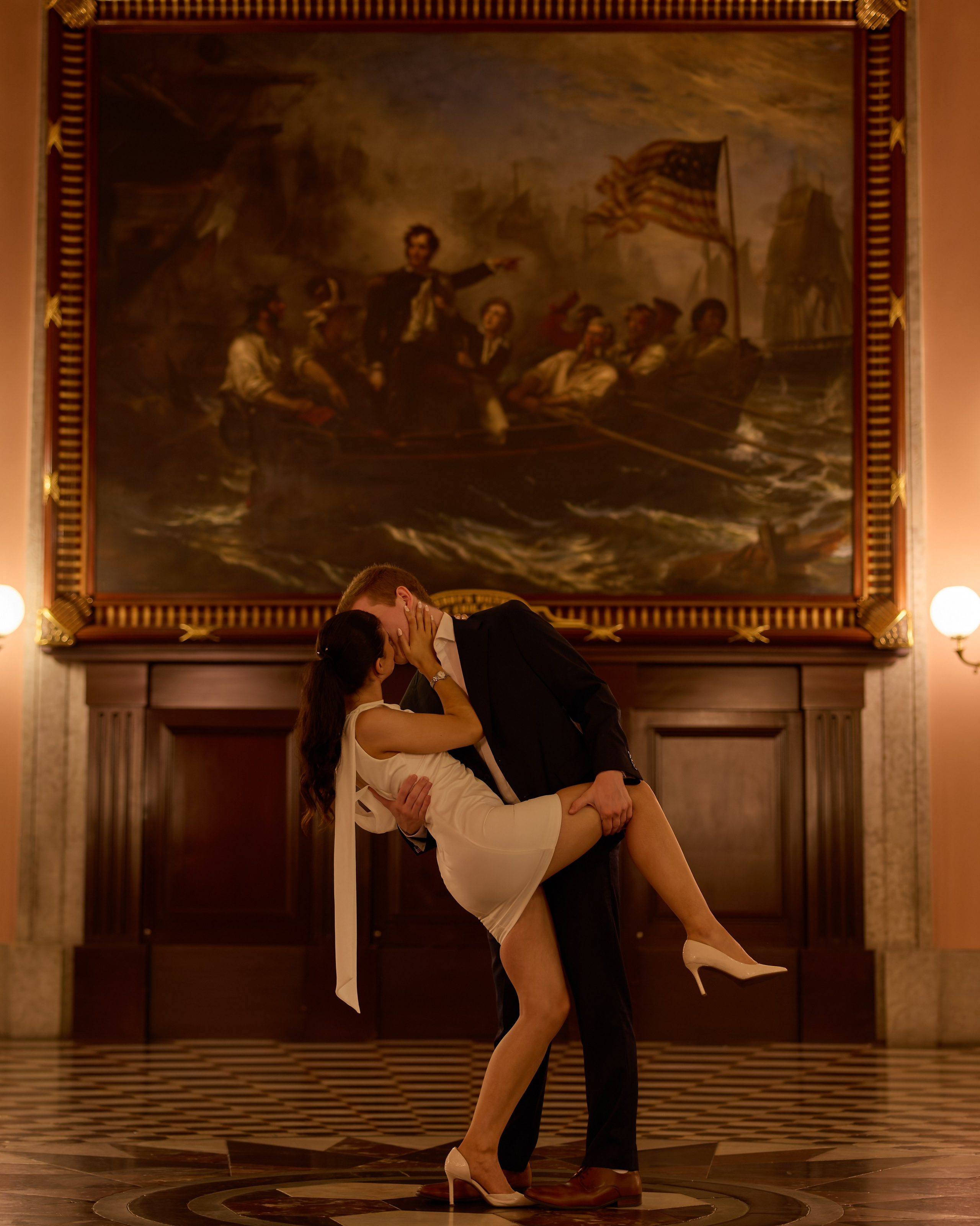 Dramatic dip kiss in the historic hall of the Ohio Statehouse in Columbus, Ohio