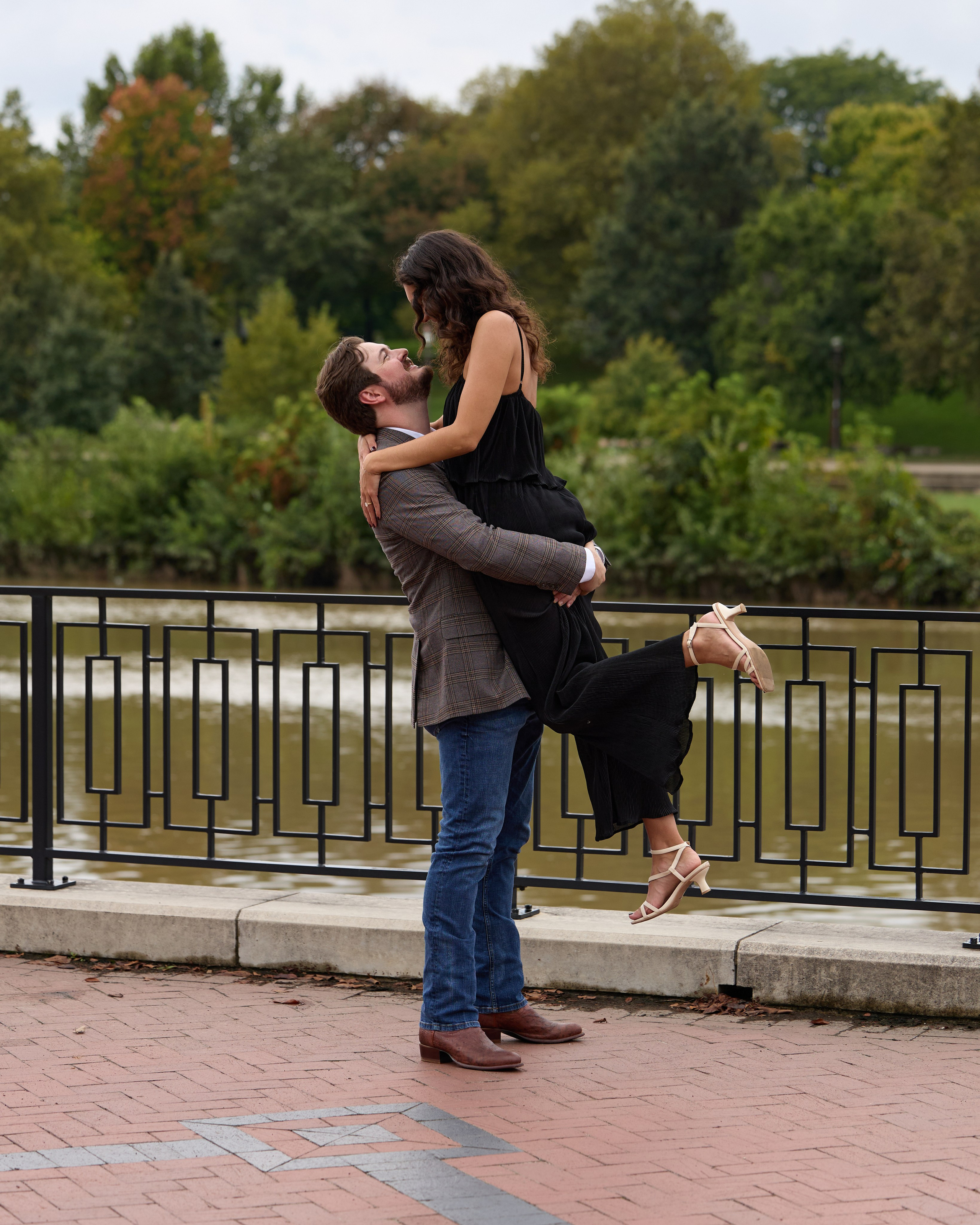 Celebration lift on a riverside terrace after a Columbus, Ohio proposal