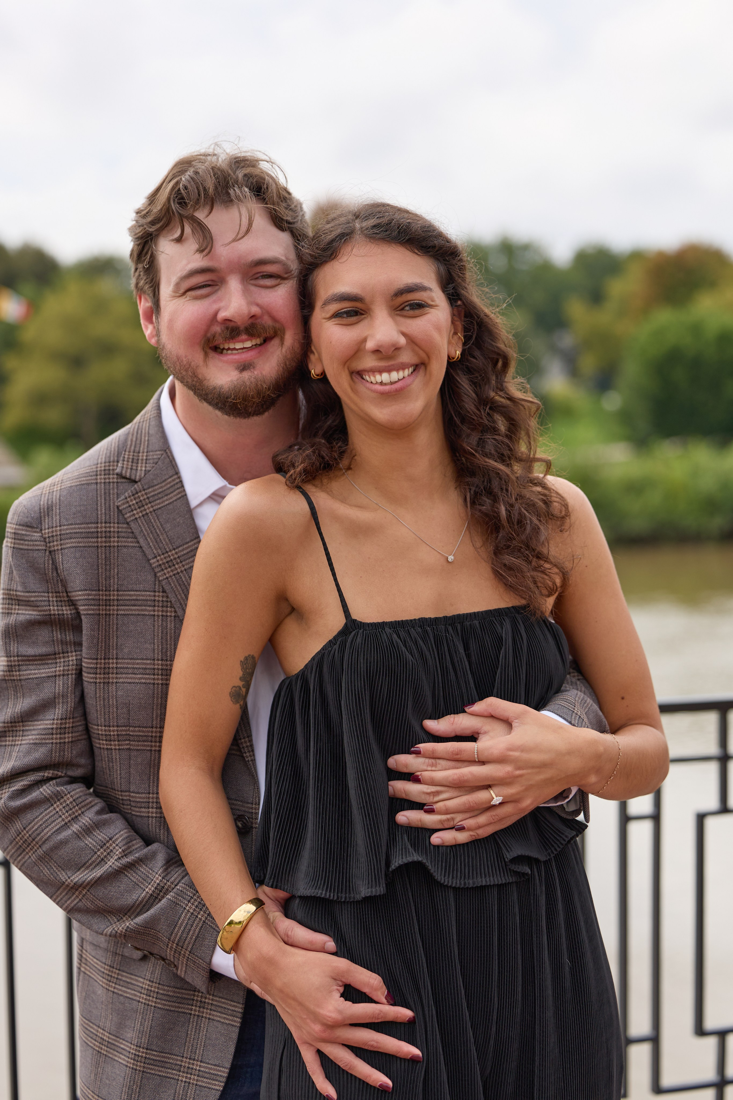 Happy couple portrait on a terrace with the Columbus skyline behind them