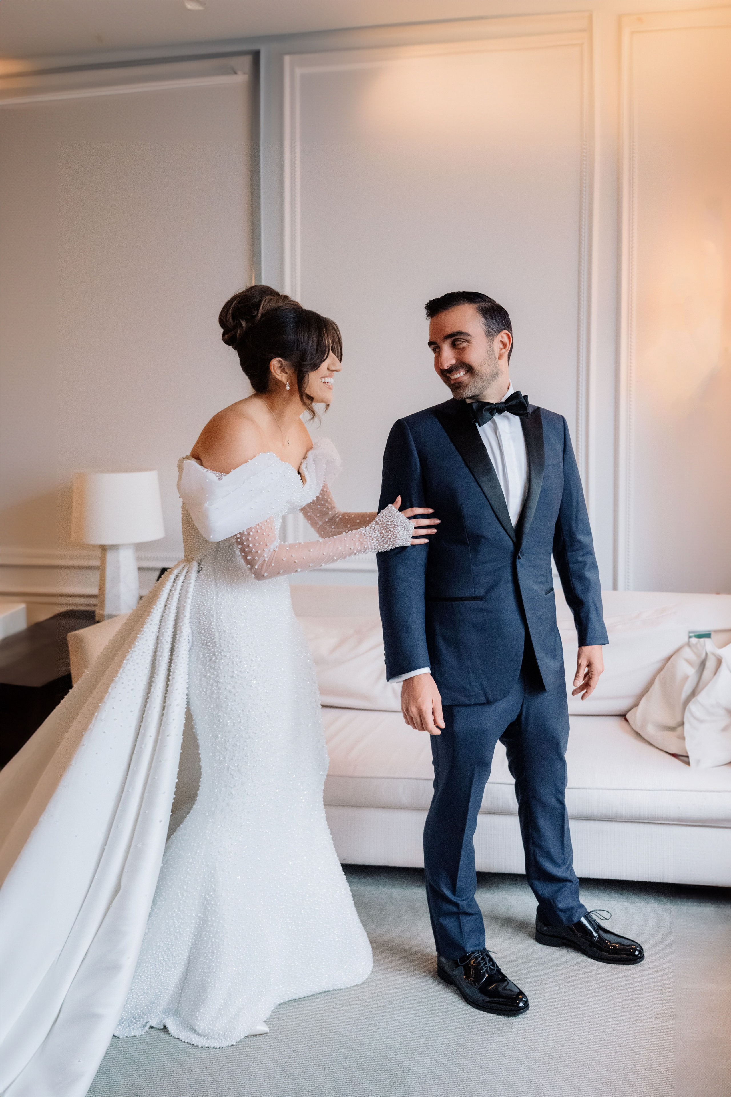 a bride and groom in a hotel room