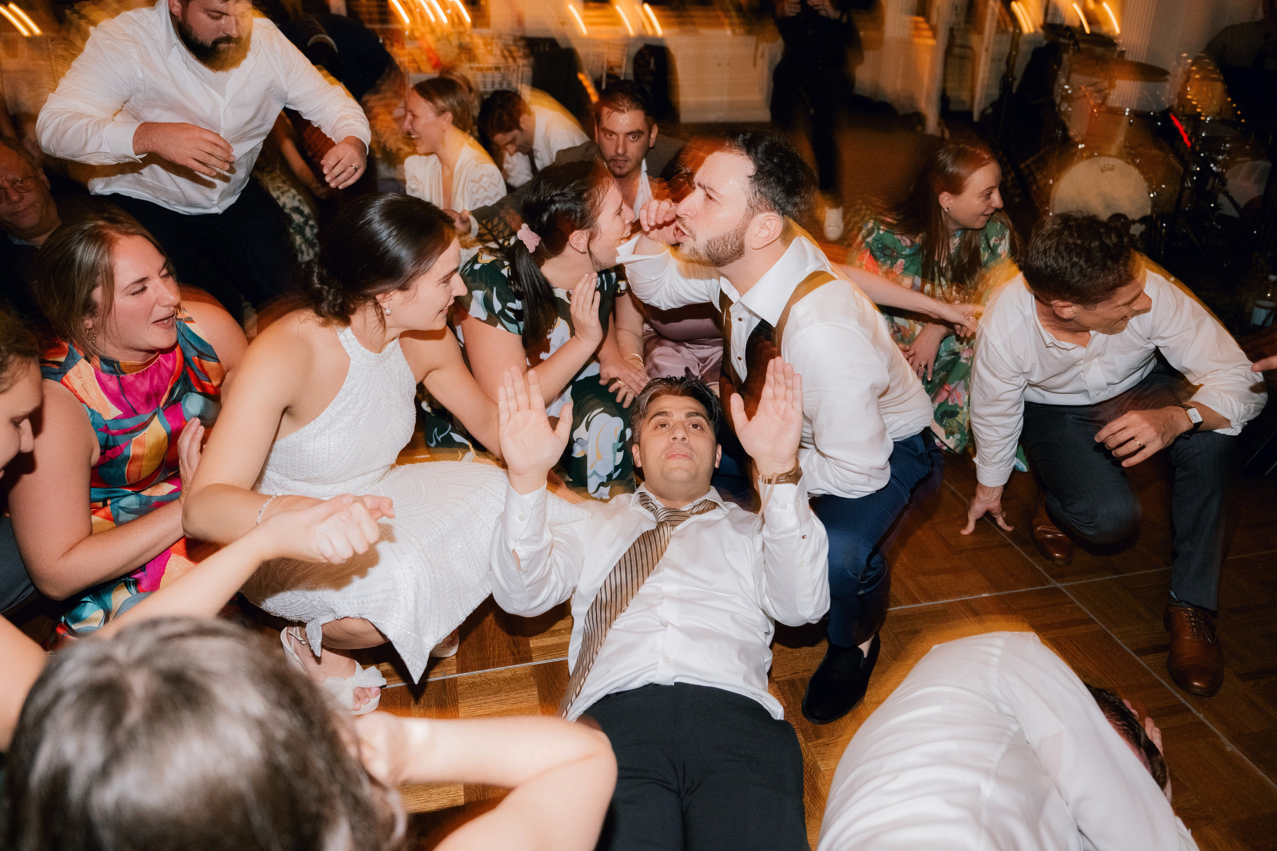 a group of people dancing on a dance floor