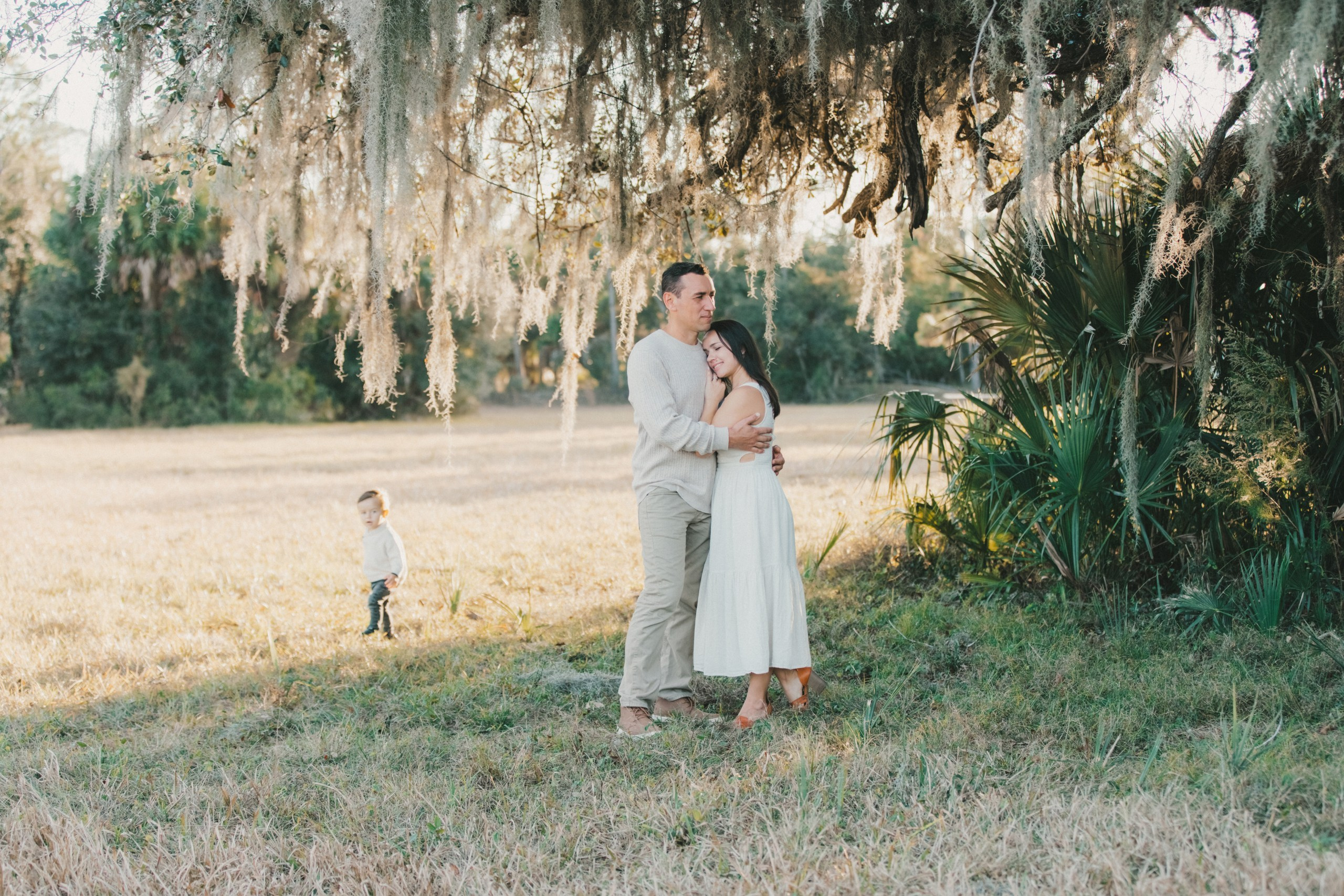 Family portrait under mossy oak trees at walton ranch preserve, classic and timeless family photography style.