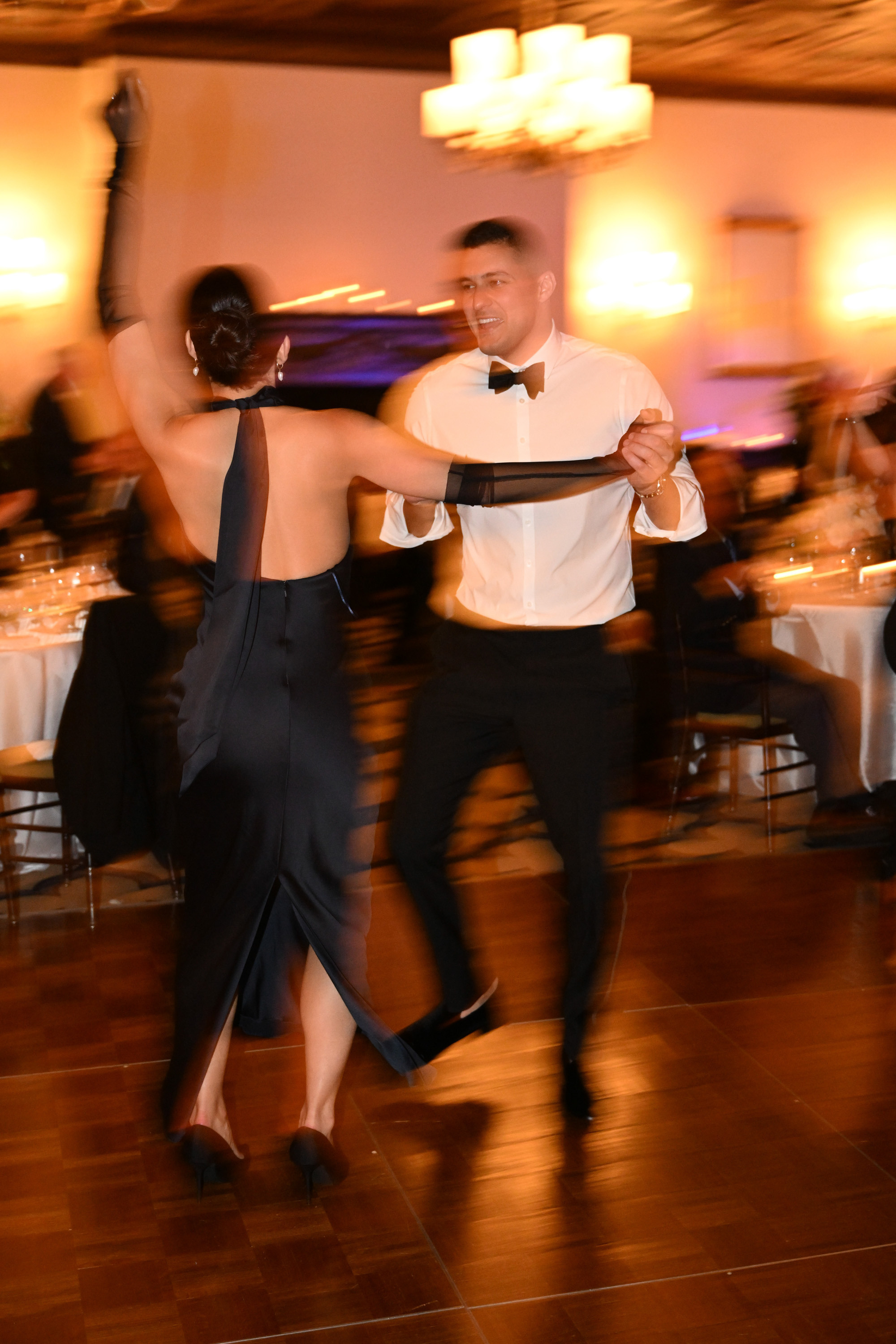 a couple dancing in a dance hall