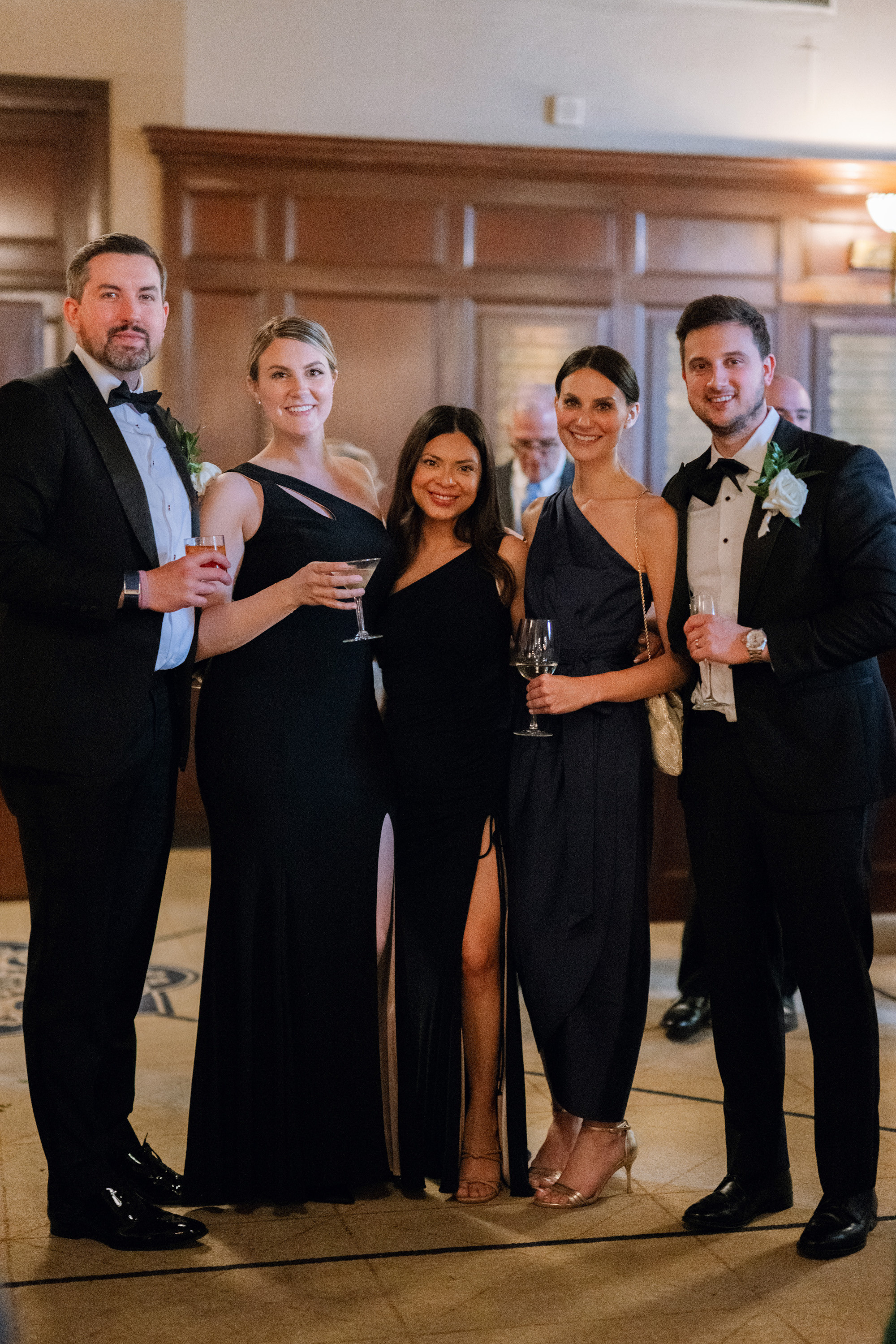 a group of people standing around a table