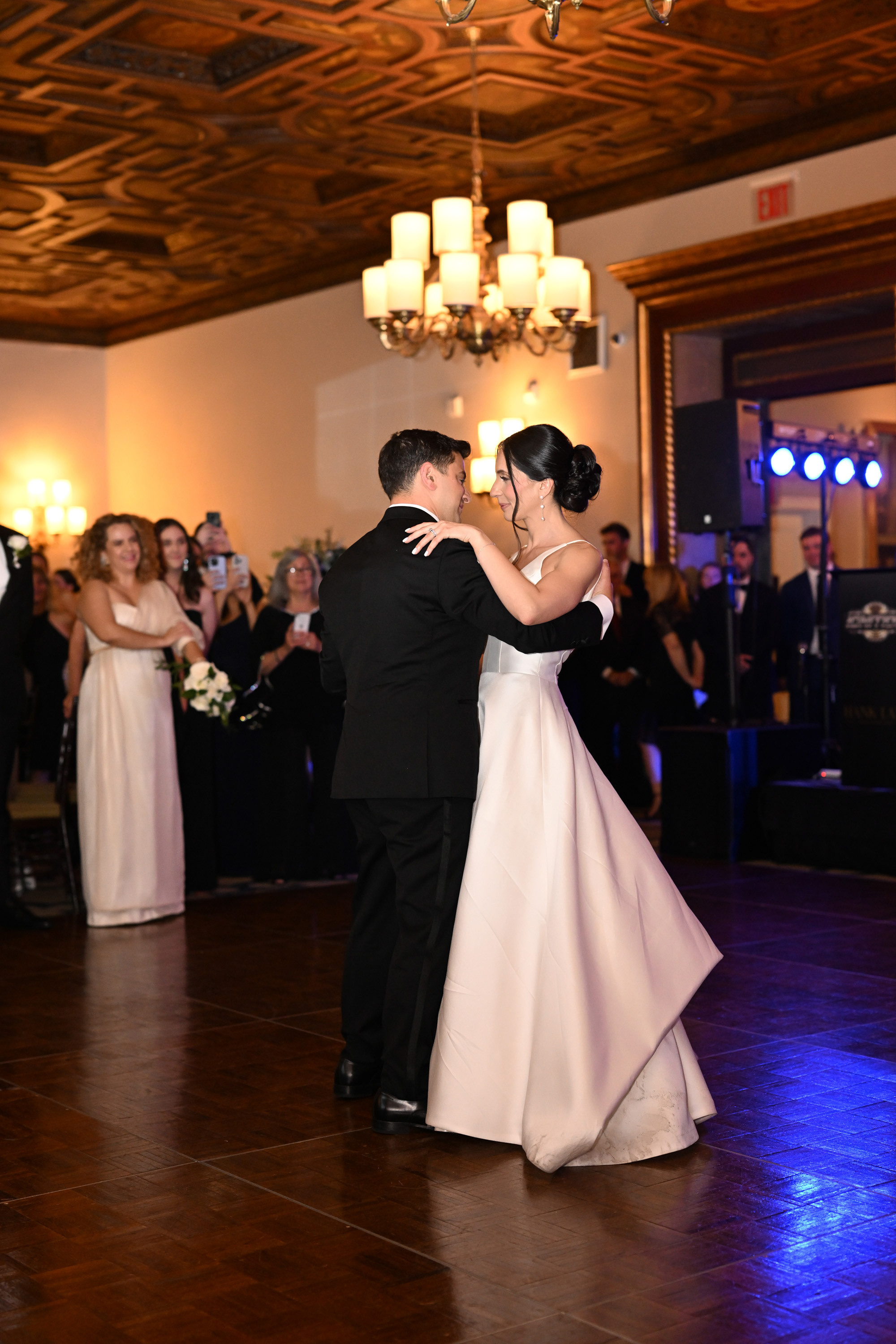 a bride and groom dance together at their wedding reception