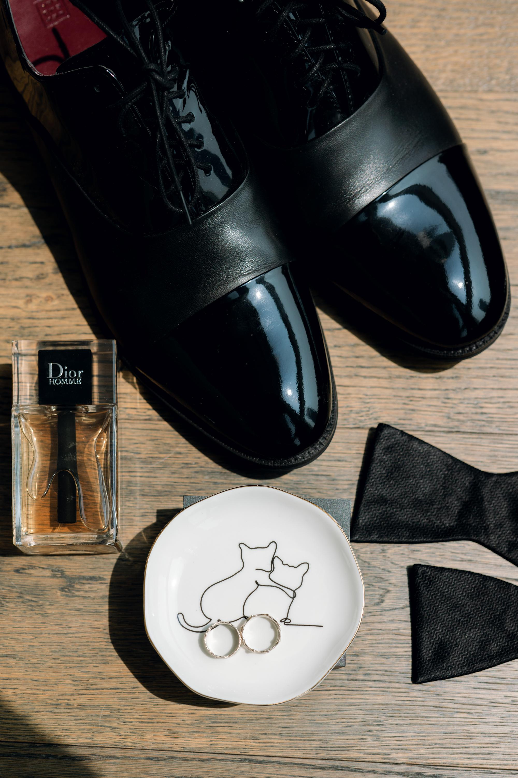 a pair of shoes, a ring, a ring and a pair of black shoes