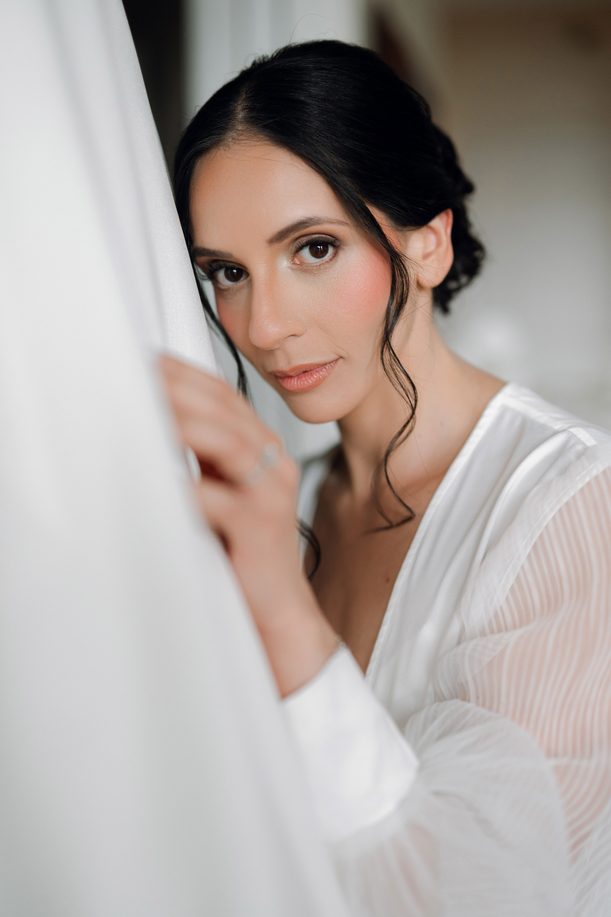 a woman in a white dress is posing