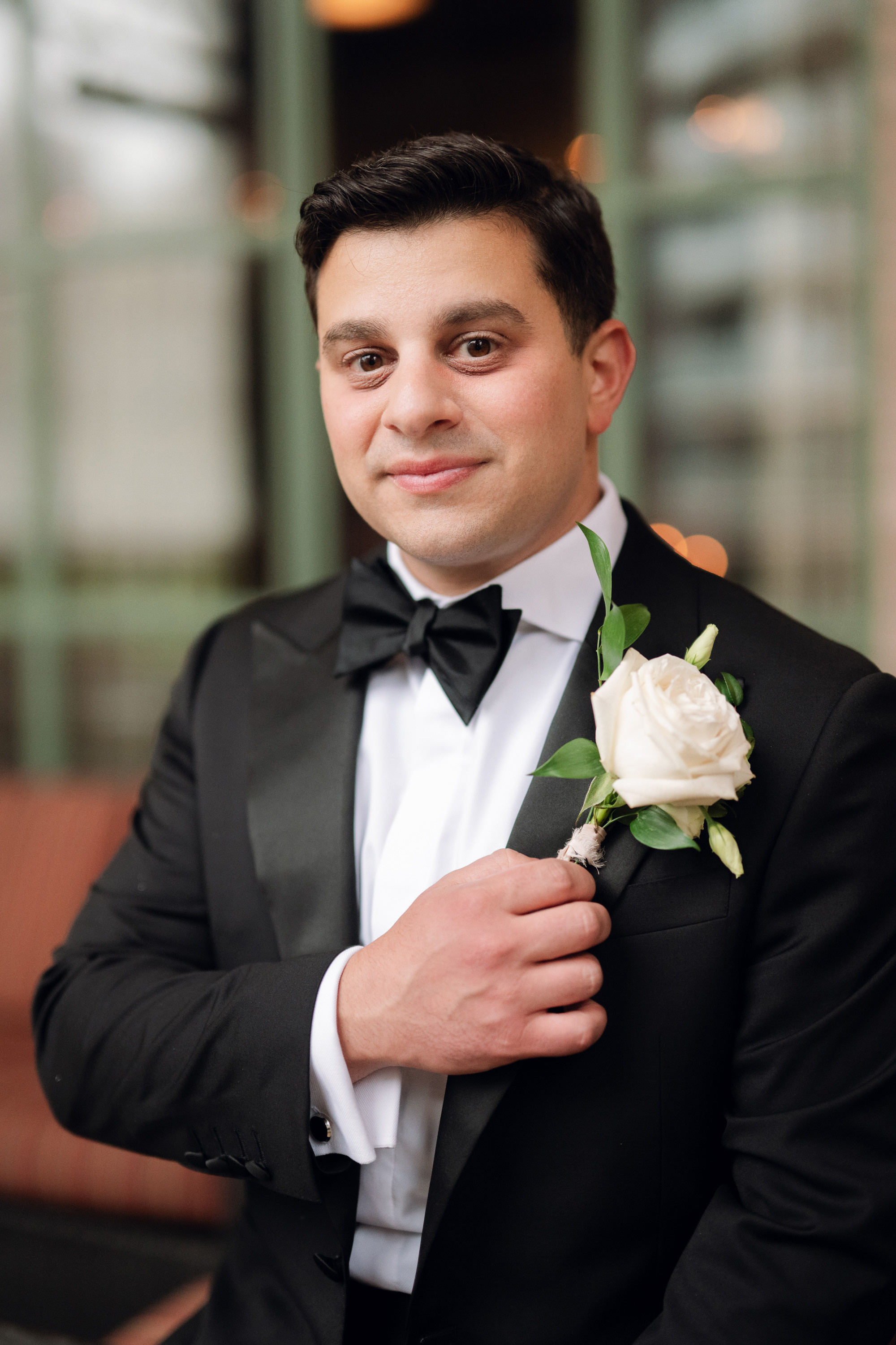 a man in a tuxed suit and bow tie
