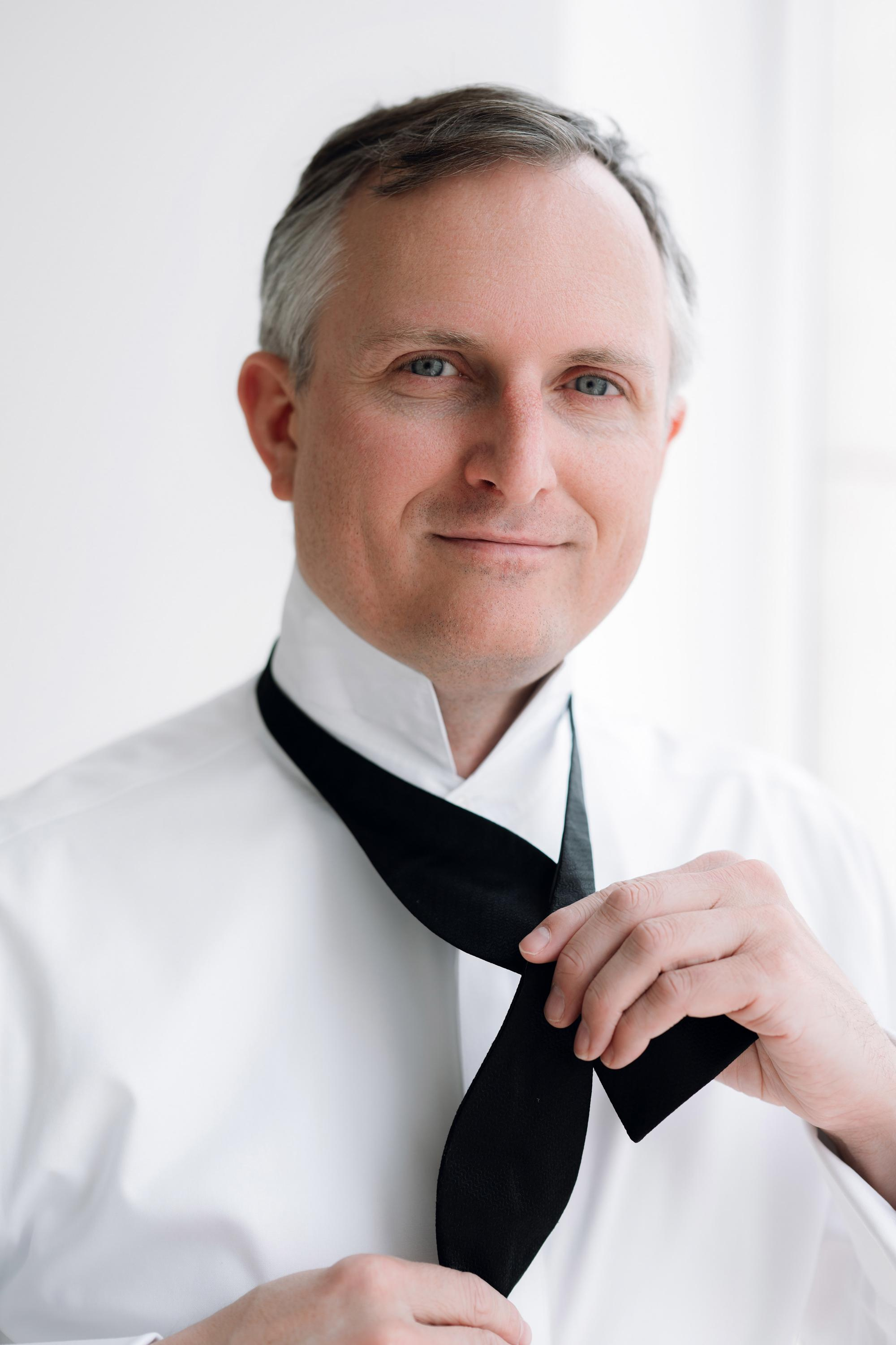 a man wearing a black tie