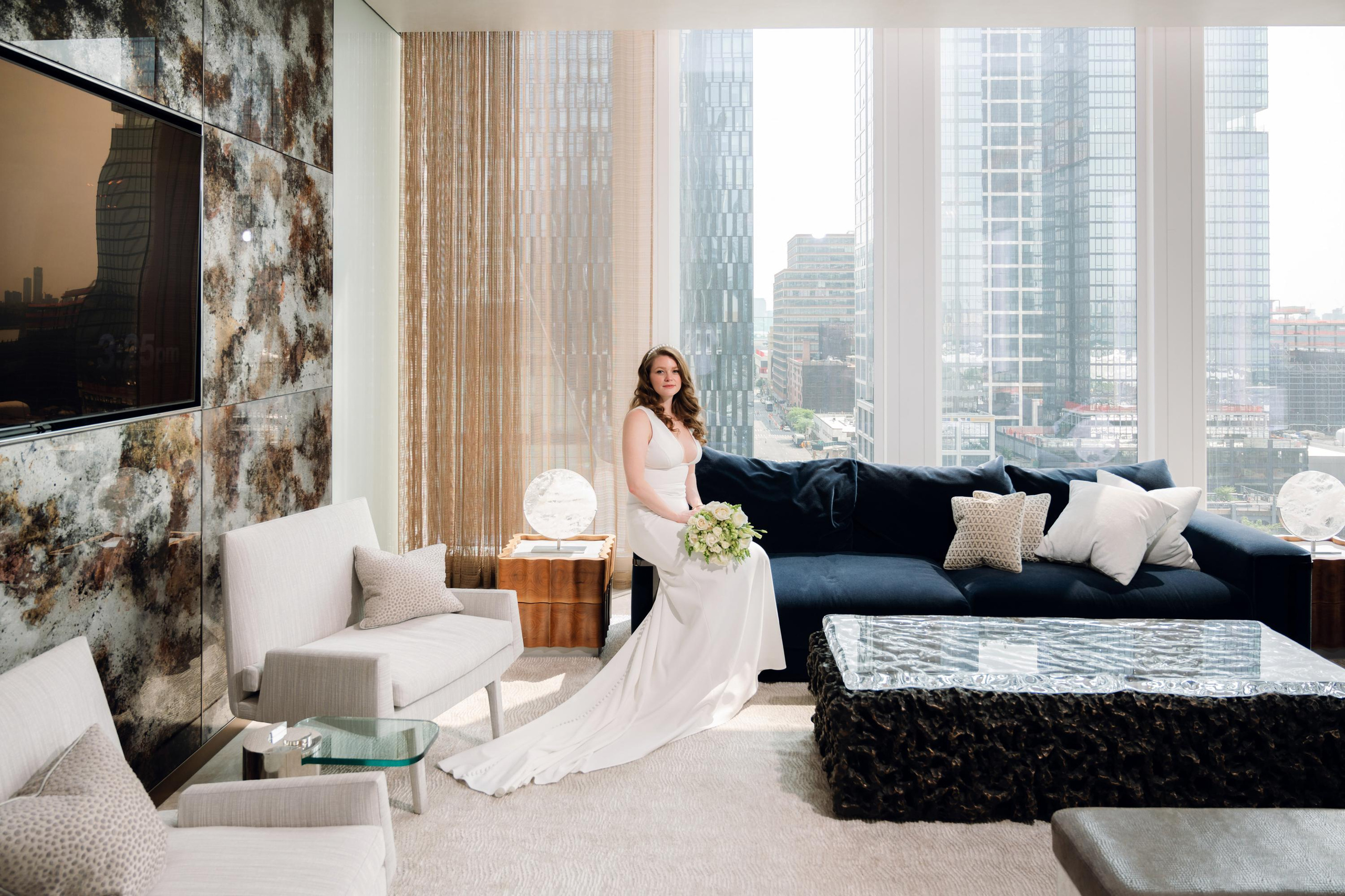 a bride sitting on a couch in a living room