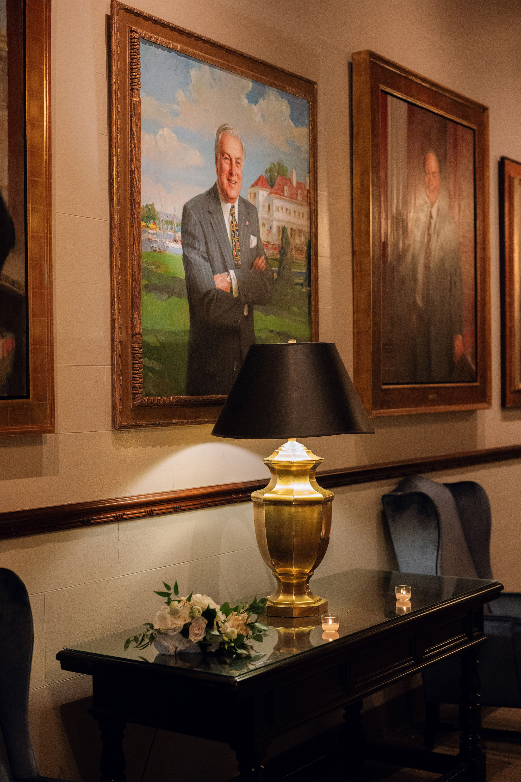 a man in a suit and tie standing in a room
